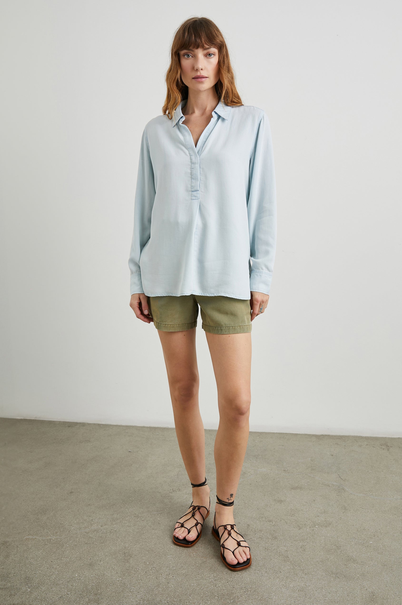 Nissa Long-Sleeve Top with a Partially Sealed Placket, a Collar and Button Cuffs in Light Vintage Colorway, a Blue - Front Full Body View Featured on Model