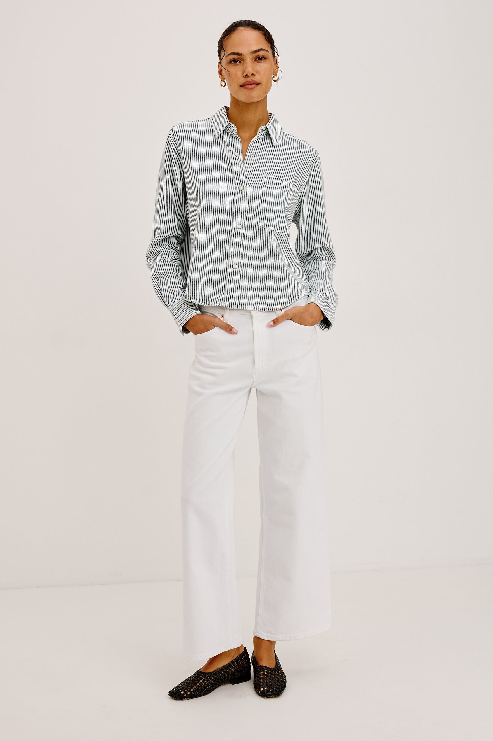 Noa Crop Denim Shirt With Boxy Fit, Front Snap Buttons, a Chest Patch Pocket, and Long Sleeves in Railroad Stripe Colorway - Full Body Front View Featured on Model