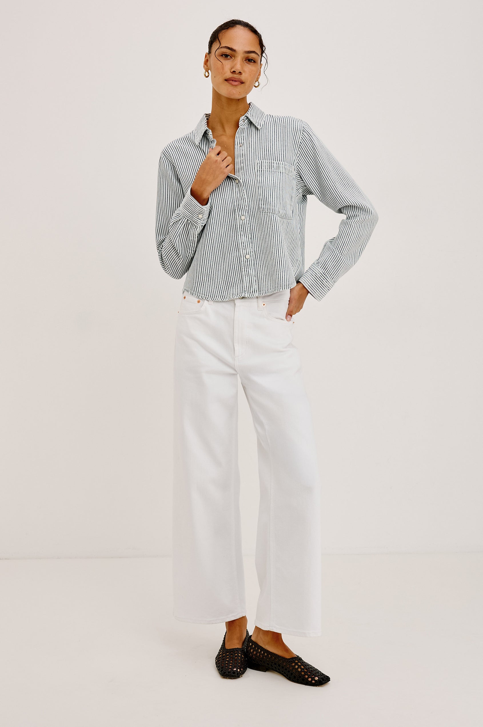 Noa Crop Denim Shirt With Boxy Fit, Front Snap Buttons, a Chest Patch Pocket, and Long Sleeves in Railroad Stripe Colorway - Full Body Front View Featured on Model