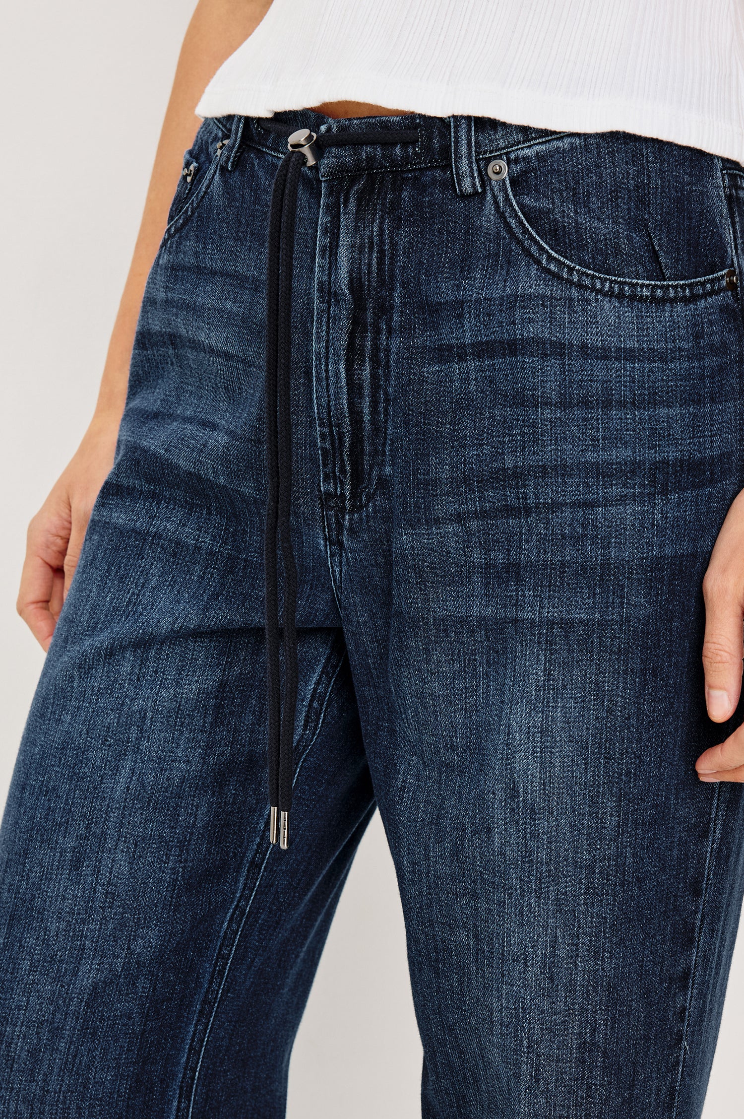 Normandie Lightweight 5-Pocket Denim Wide Leg Pant with front zipper button fly and a drawstring tie at waist in Oceana Colorway. Close Up Front View Featured on Model.