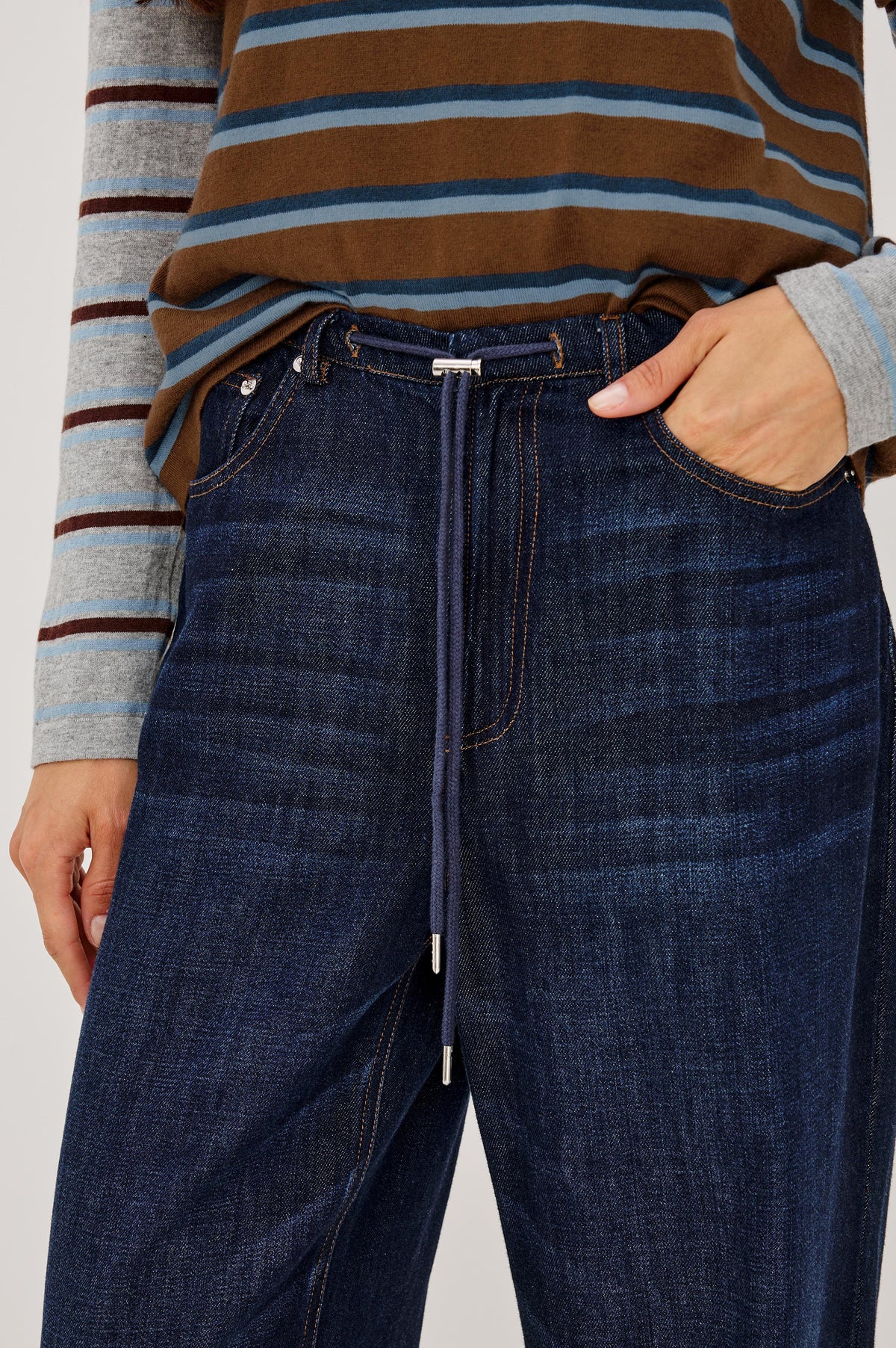 Normandie Pant in Cotton-Lyocell Blend With Relaxed Wide Legs, Drawstring Waistband, Zip Fly, and 5-Pockets in Rinse Wash Colorway - Mid Body Front View Featured on Model