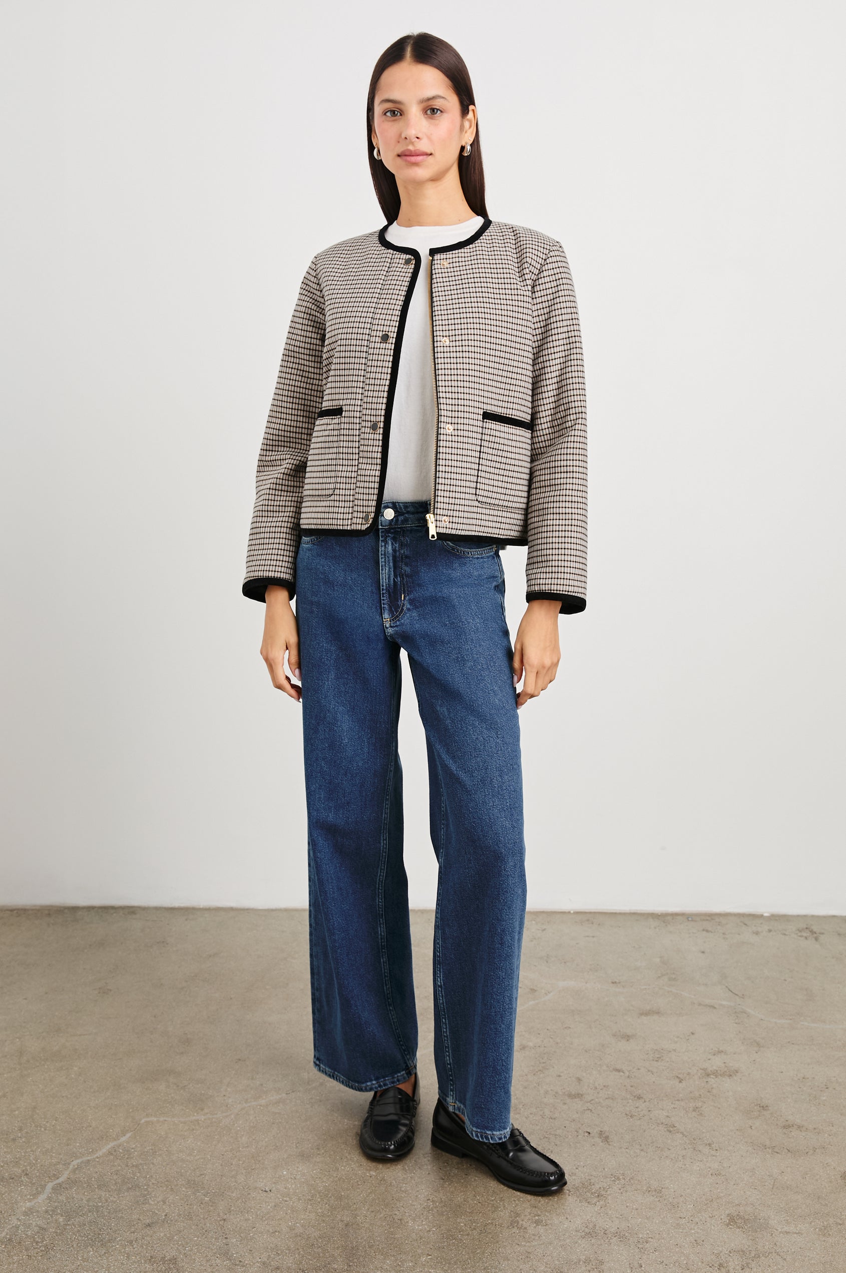 Nota Cropped Jacket with Snap and Zipper Closure and Two Front Patch Pockets in Ice Taupe Mini Check Colorway, a black and brown plaid with black trim - Front Full Body View Featured on Model