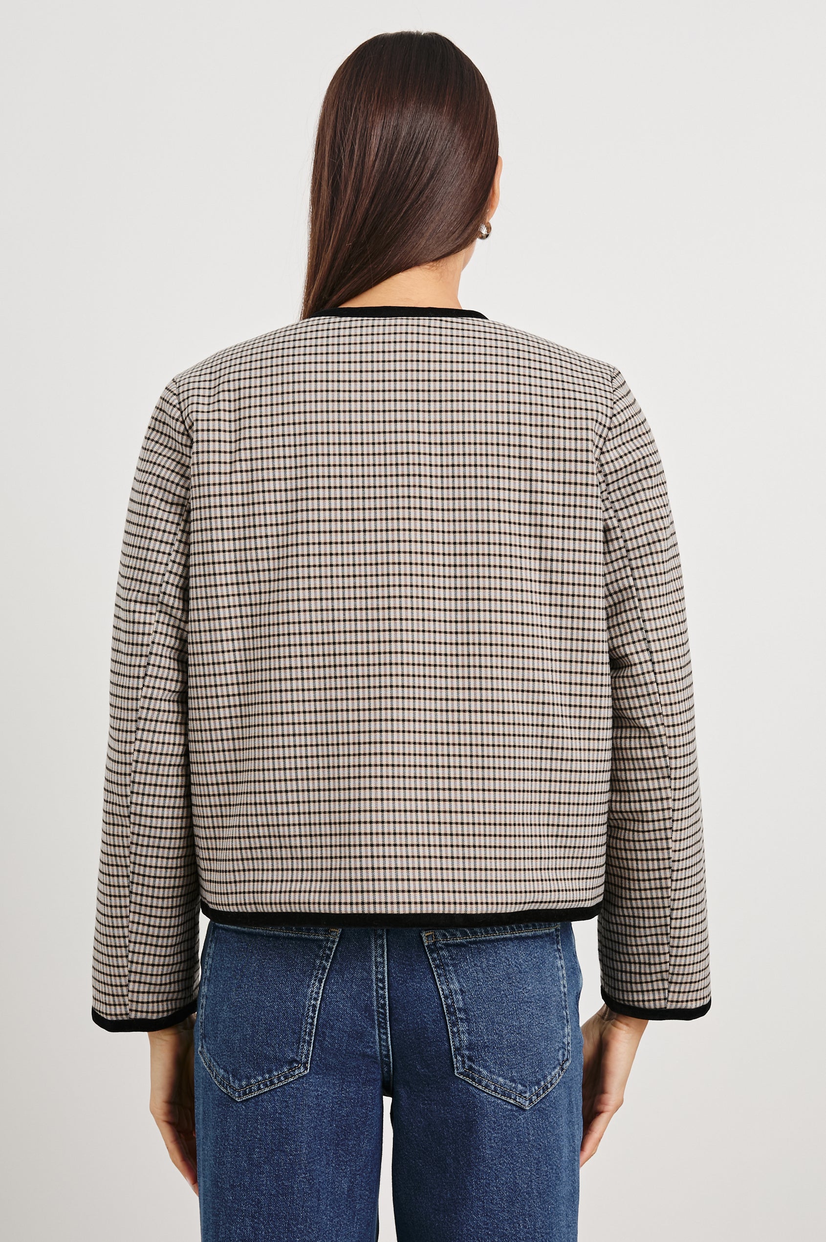 Nota Cropped Jacket with Snap and Zipper Closure and Two Front Patch Pockets in Ice Taupe Mini Check Colorway, a black and brown plaid with black trim - Back View Featured on Model