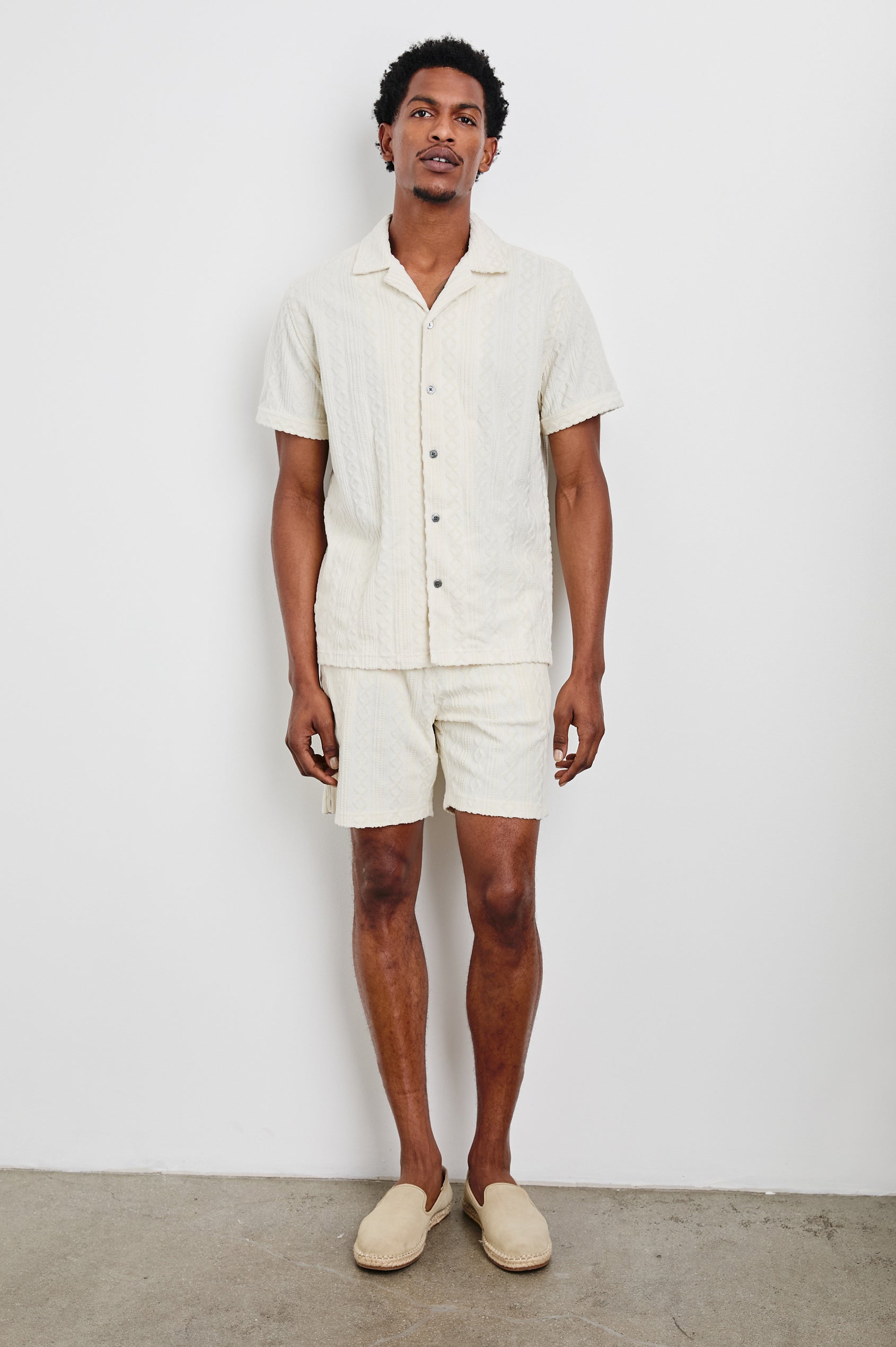 Nova Shorts with a Drawstring Waist, a Raised Jacquard Pattern, Two Front Pockets and a Back Patch Pocket in Ecru Colorway - Front Full Body View Featured on Model