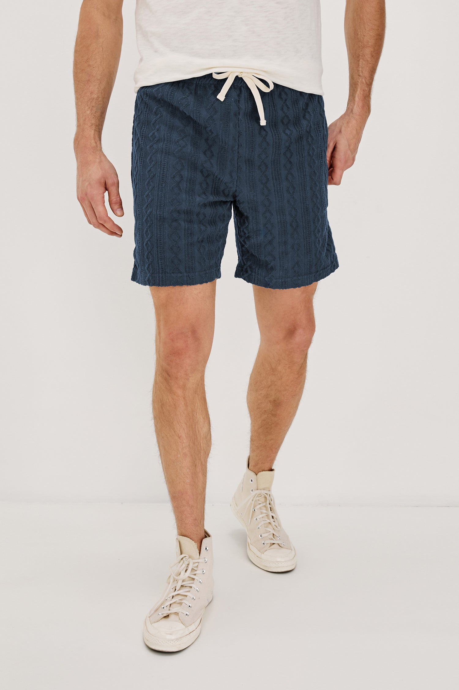 Nova Shorts with a Drawstring Waist, a Raised Jacquard Pattern, Two Front Pockets and a Back Patch Pocket in Ecru Colorway - Front View Featured on Model