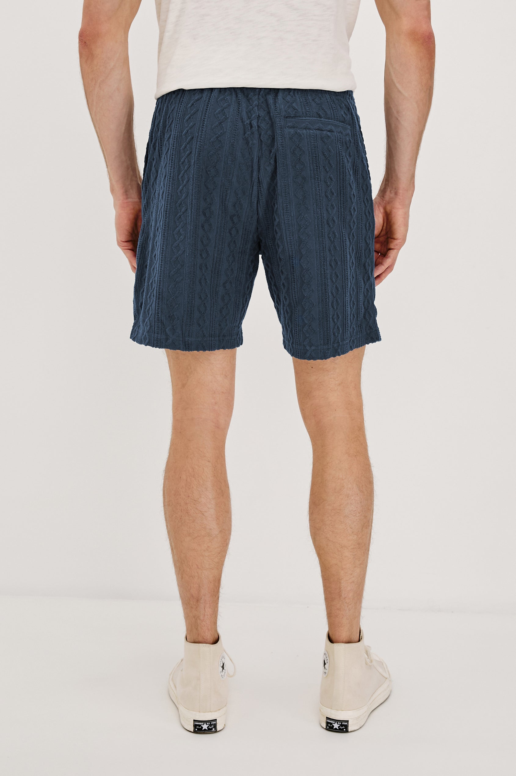 Nova Shorts with a Drawstring Waist, a Raised Jacquard Pattern, Two Front Pockets and a Back Patch Pocket in Ecru Colorway - Back View Featured on Model