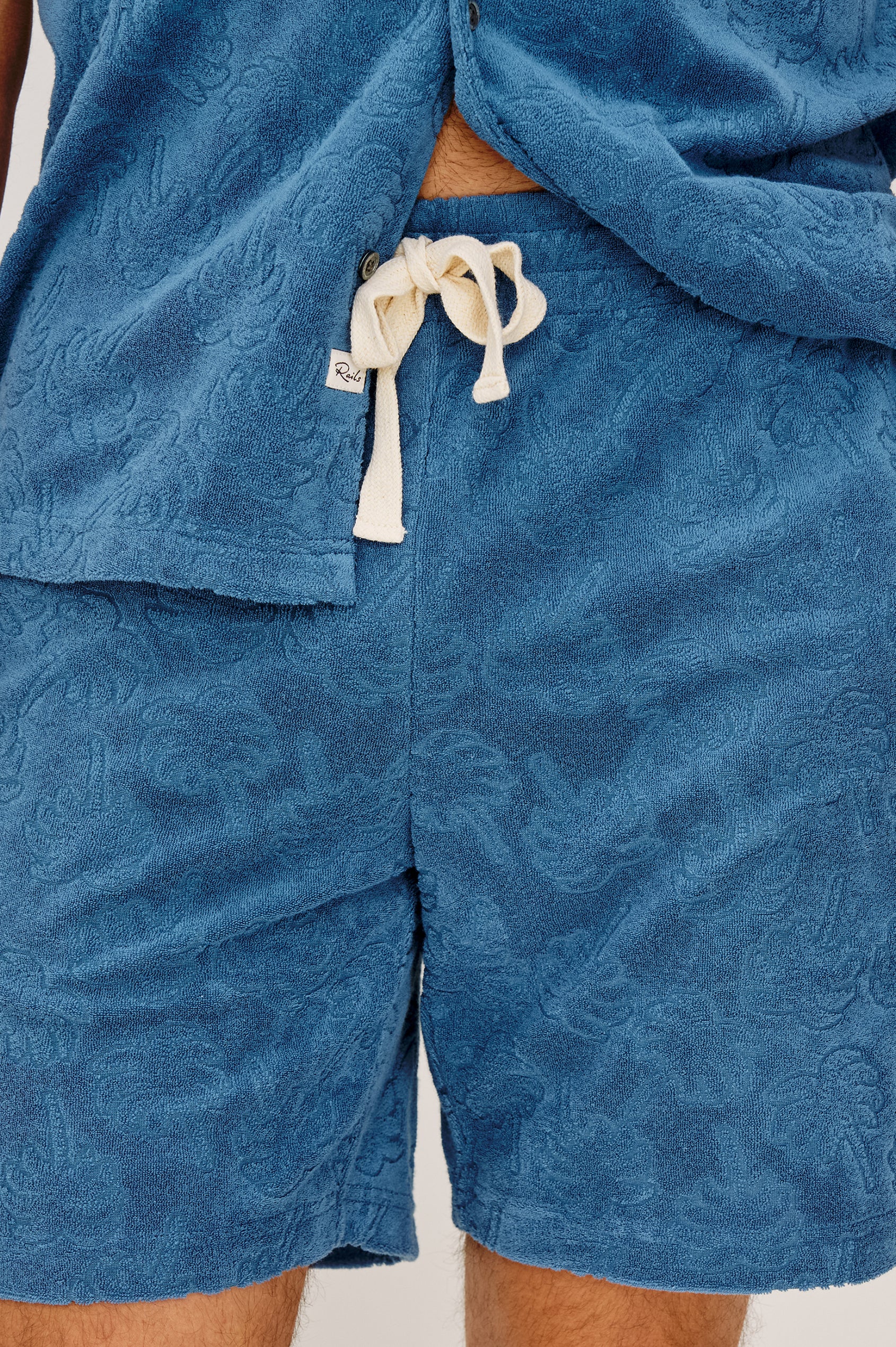 Nova Short in French Terry With Raised Jacquard Pattern, Side Pockets, and Drawstring Waist Ties in Royal Palm Colorway - Lower Body Front View Featured on Model