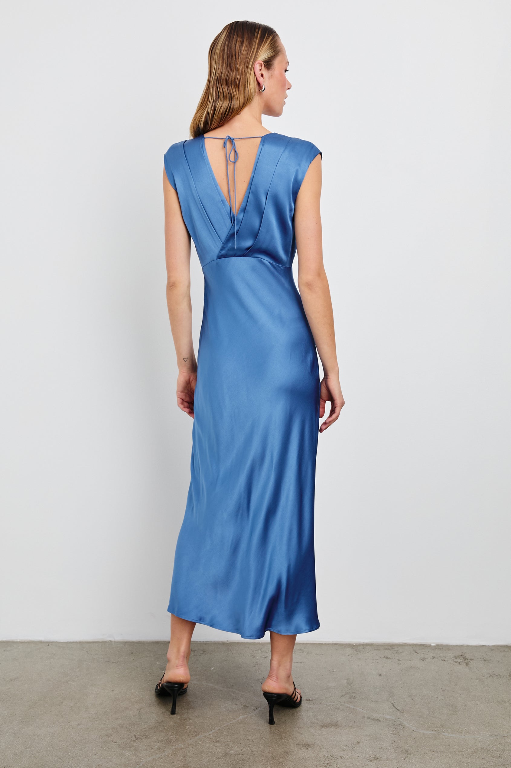 Odella Midi Dress with Cap Sleeves, Double Front Crossover Bodice, Deep V Neck and a Back Neck Tie in Atlantic Colorway - Back Full Body View Featured on Model 