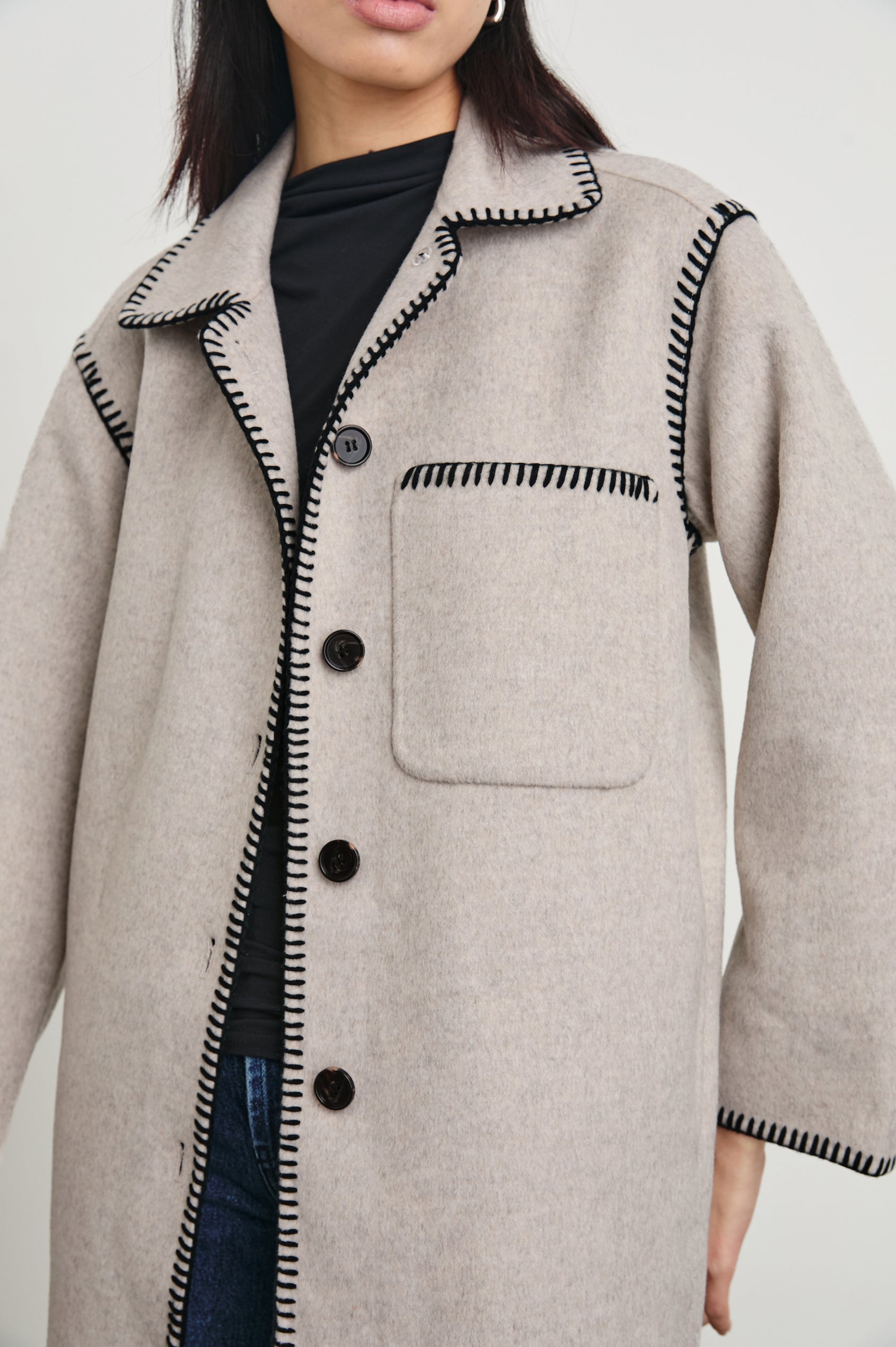 Odyssey Jacket with Four Button Closure and a Chest Patch Pocket in Oatmeal Colorway, with black contrast stitching - Front View Featured on Model