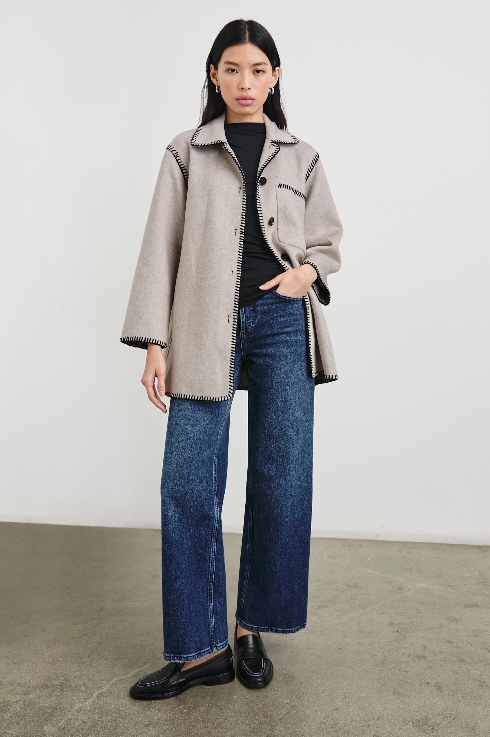 Odyssey Jacket with Four Button Closure and a Chest Patch Pocket in Oatmeal Colorway, with black contrast stitching - Front Full Body View Featured on Model