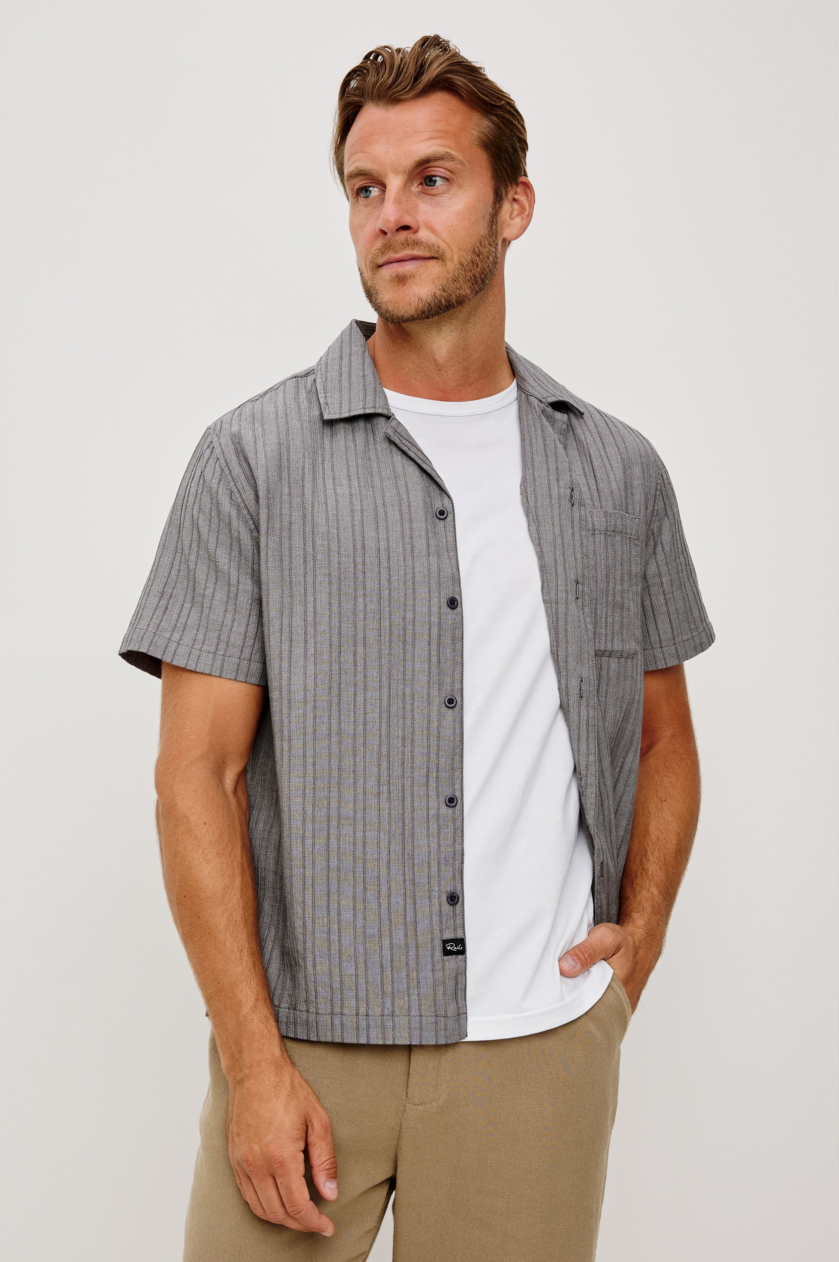 Ohana Button-Up Shirt in Textured Shirting WIth Short Sleeves, Collar, and Relaxed Fit in Charcoal Chambray Colorway - Upper Body Front View Featured on Model