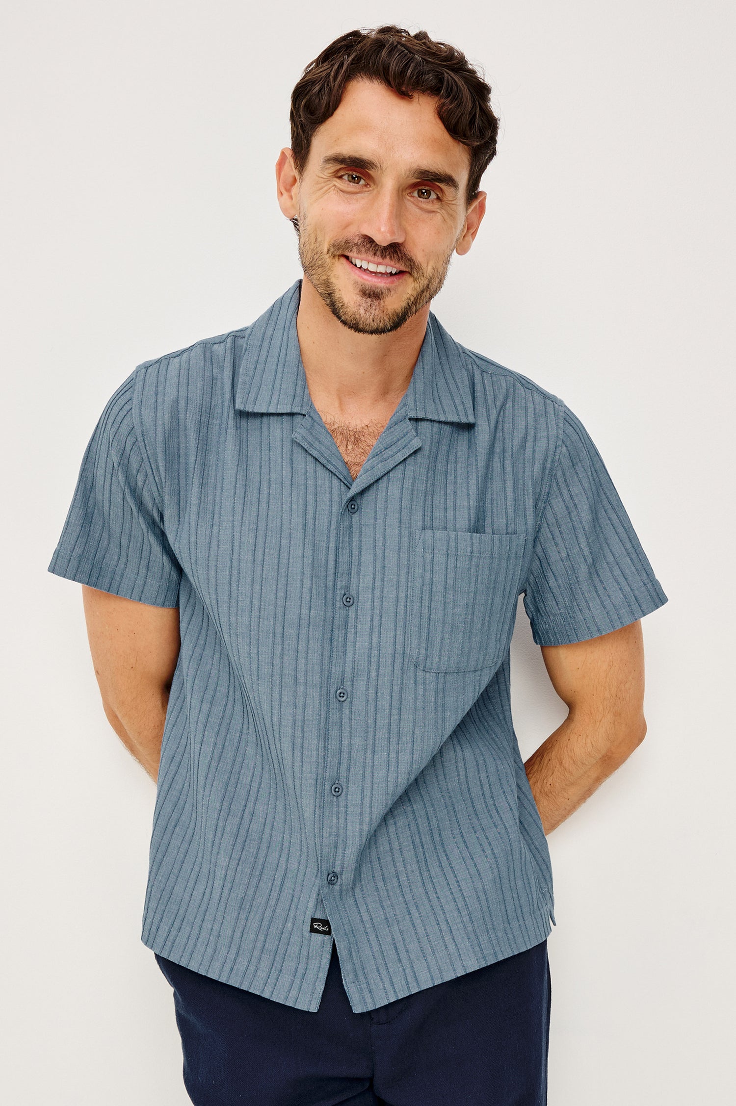Ohana Button-Up Shirt in Textured Shirting WIth Short Sleeves, Collar, and Relaxed Fit in Marine Colorway - Upper Body Front View Featured on Model