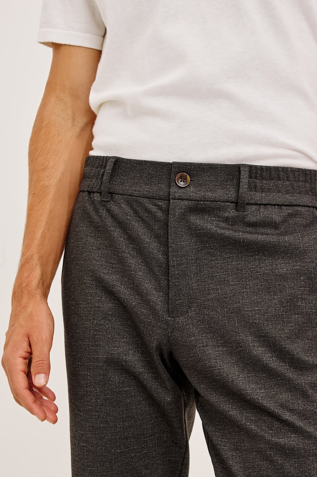 Olivier Pant in Stretch Ponte Knit With Slim Legs, Clean Front Waistband With Belt Loops, Elasticated Sides and Back, Front Zip Fly, Side Slash Pockets, and Back Welt Pockets in Umber Colorway - Lower Body Front View Featured on Model