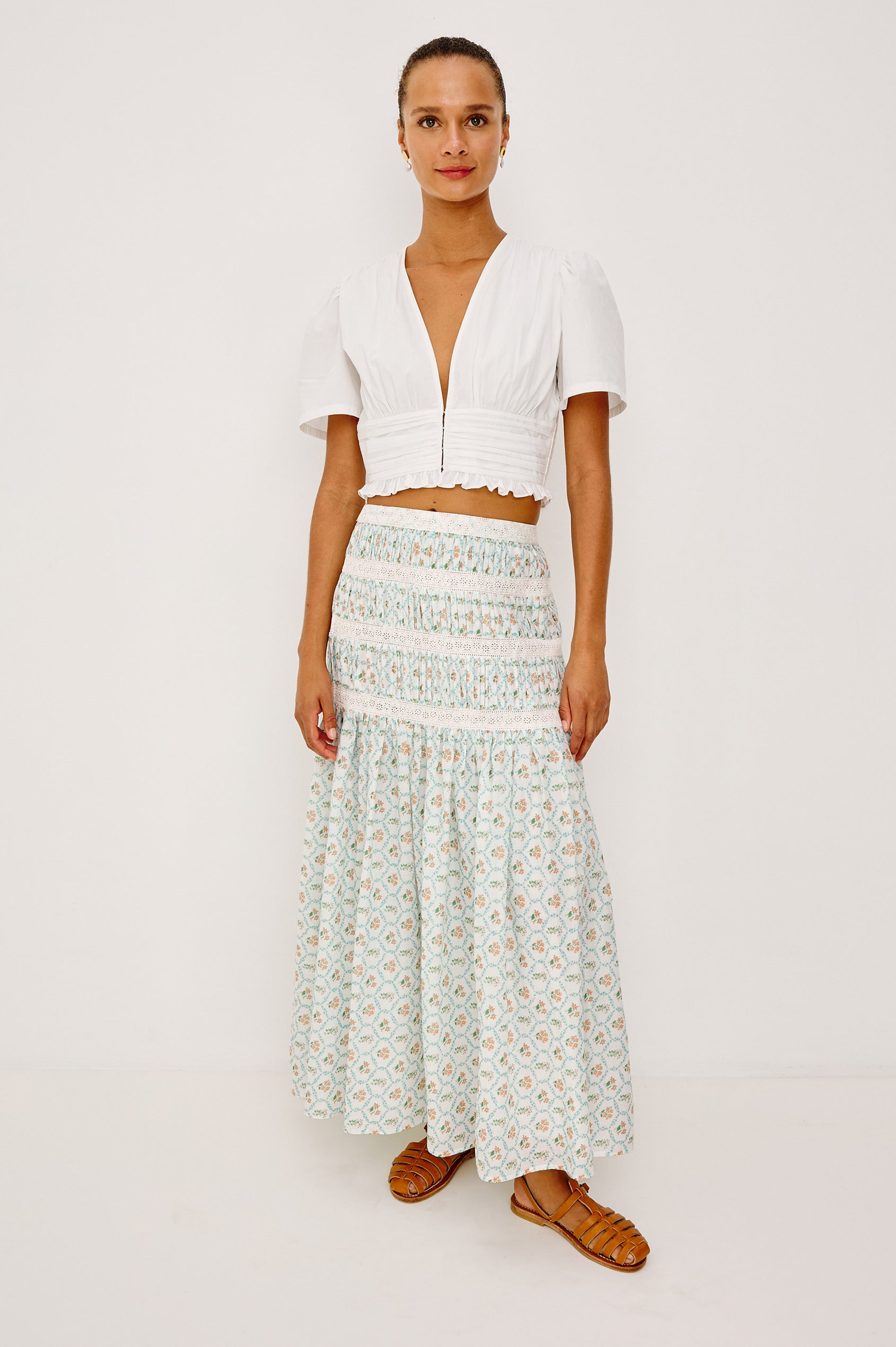 Olympia Super Croped Top in Cotton Poplin With Wide Cap Sleeves, Shirred Waist Panel, Front Hook-and-Eye Closures, V-Neckline, Wide Cap Sleeves, and is Fully Lined in White Colorway - Full Body Front View Featured on Model