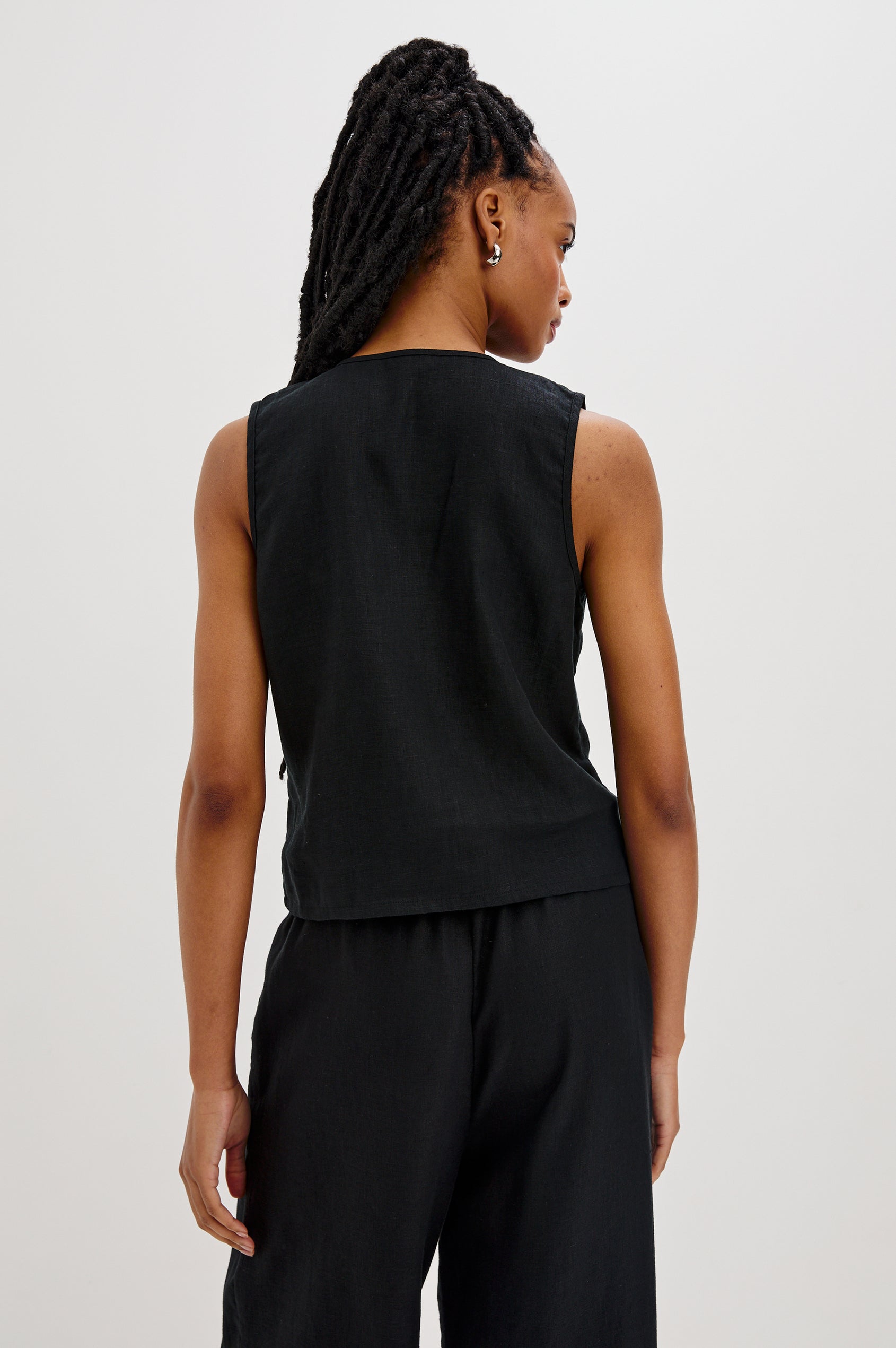 Oregon Sleeveless Vest Top with Tie Front in Black Colorway. Back View Shown on Model.