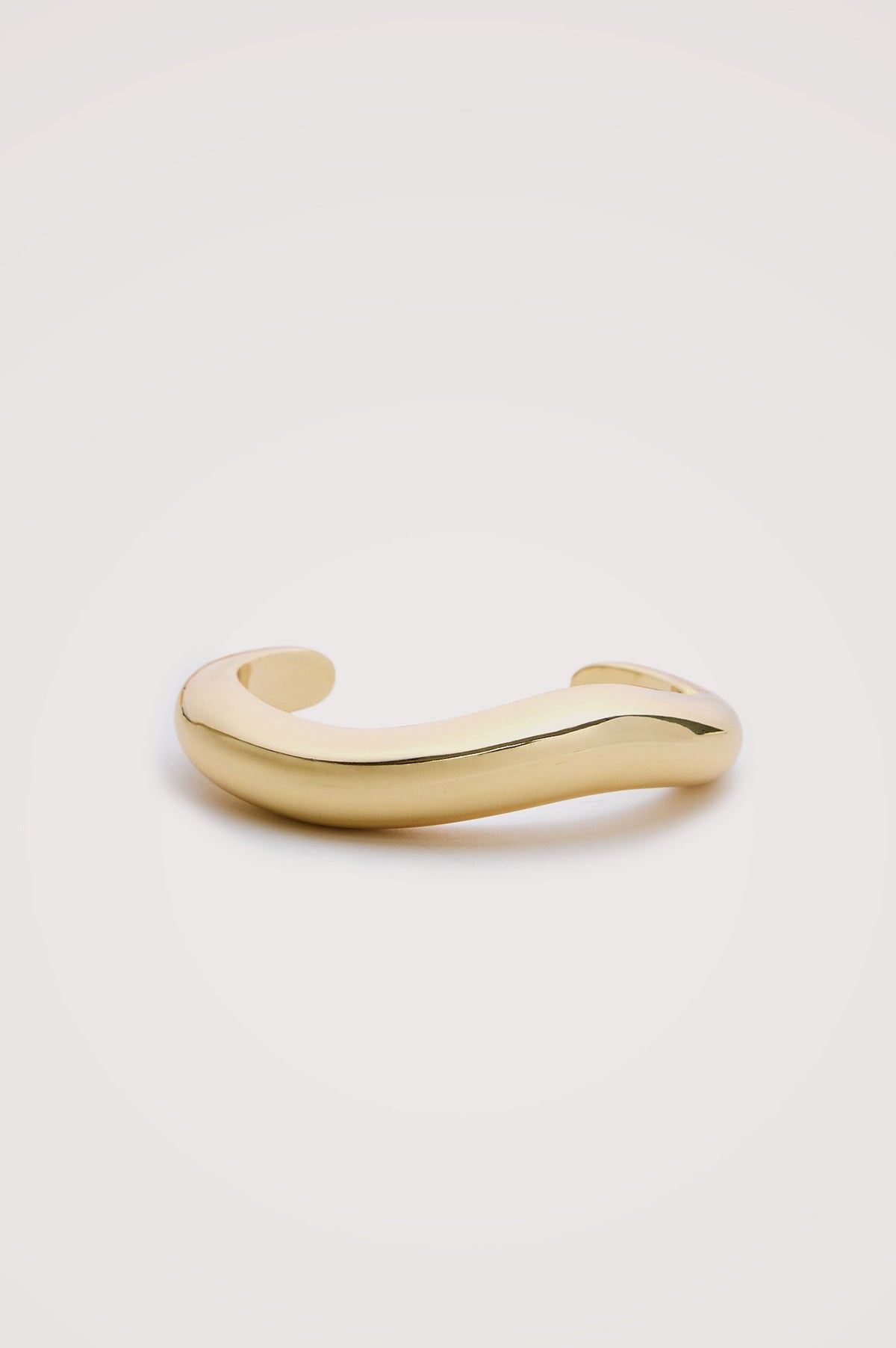 Organic Shaped Cuff Bracelet With Open Back and Engraved Interior Rails Logo in Gold Colorway -