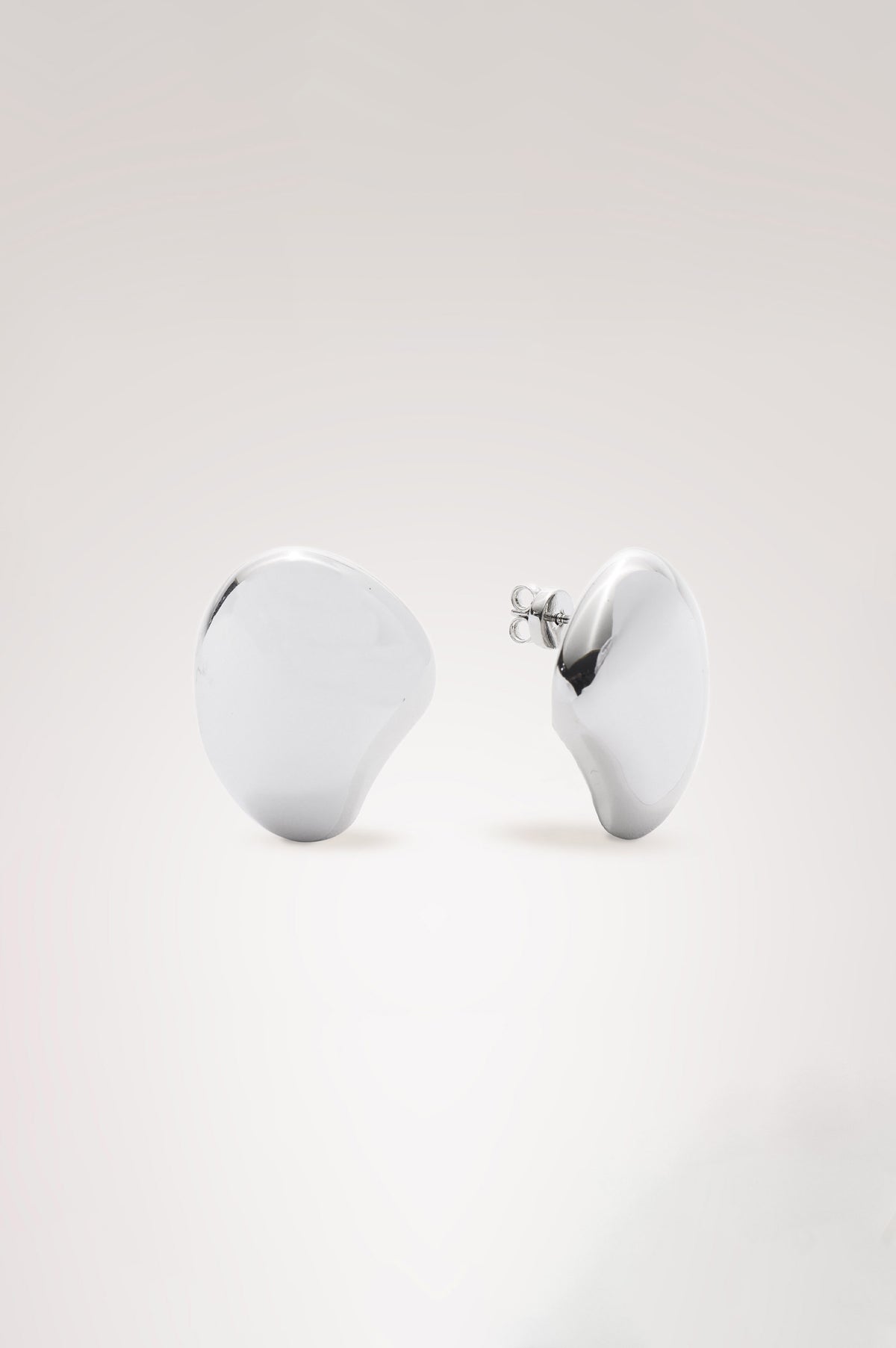Organic Shaped Dome Earrings With Push Back Post Closure  in Silver Colorway - Flat Lay Product View Featured