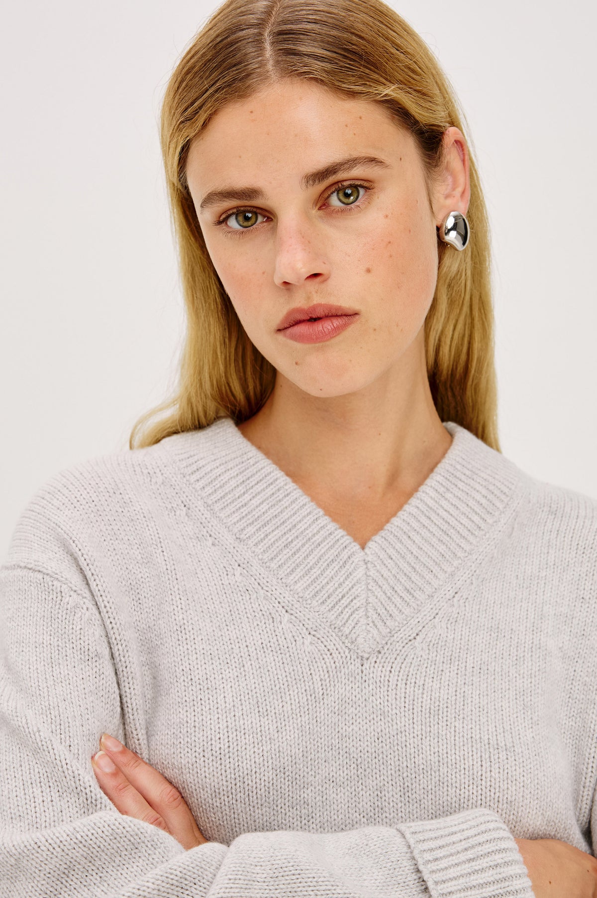 Organic Shaped Dome Earrings With Push Back Post Closure in Silver Colorway - Upper Body Front View Featured on Model