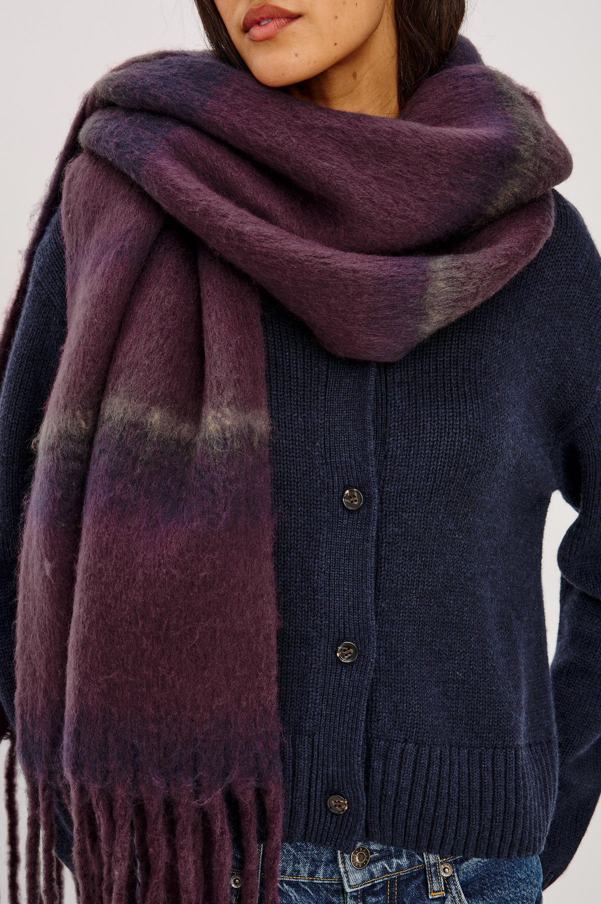 Oslo Scarf in Brushed Polyester Knit With Oversized Shape and Fringe Trim in Wine Indigo Stripe Colorway - Upper Body Front Detail View Featured on Model.