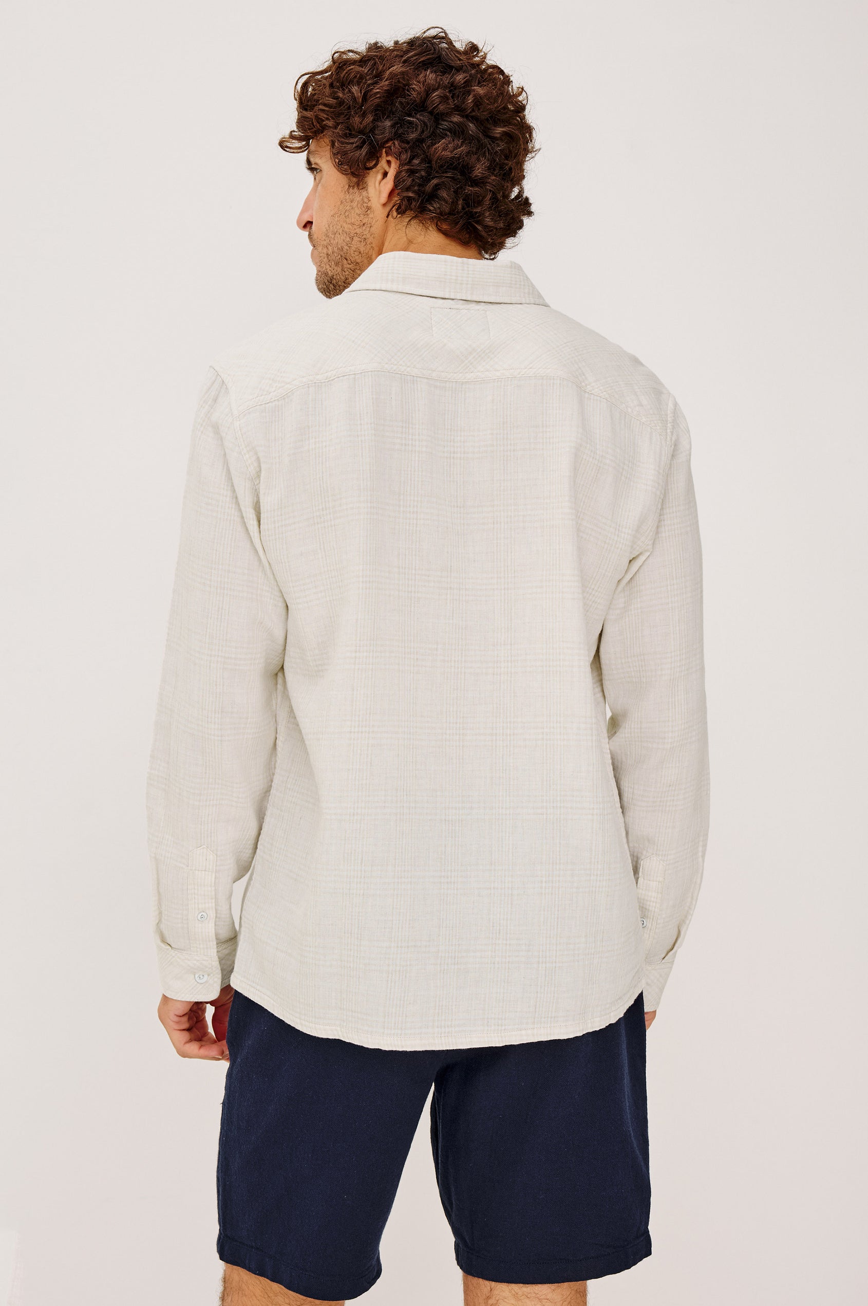 Owens Shirt in Lightweight Cotton With Front Buttons, Subtle Texture, Collar, Long Sleeves, and Chest Patch Pocket in Desert Path Colorway - Upper Body Back View Featured on Model