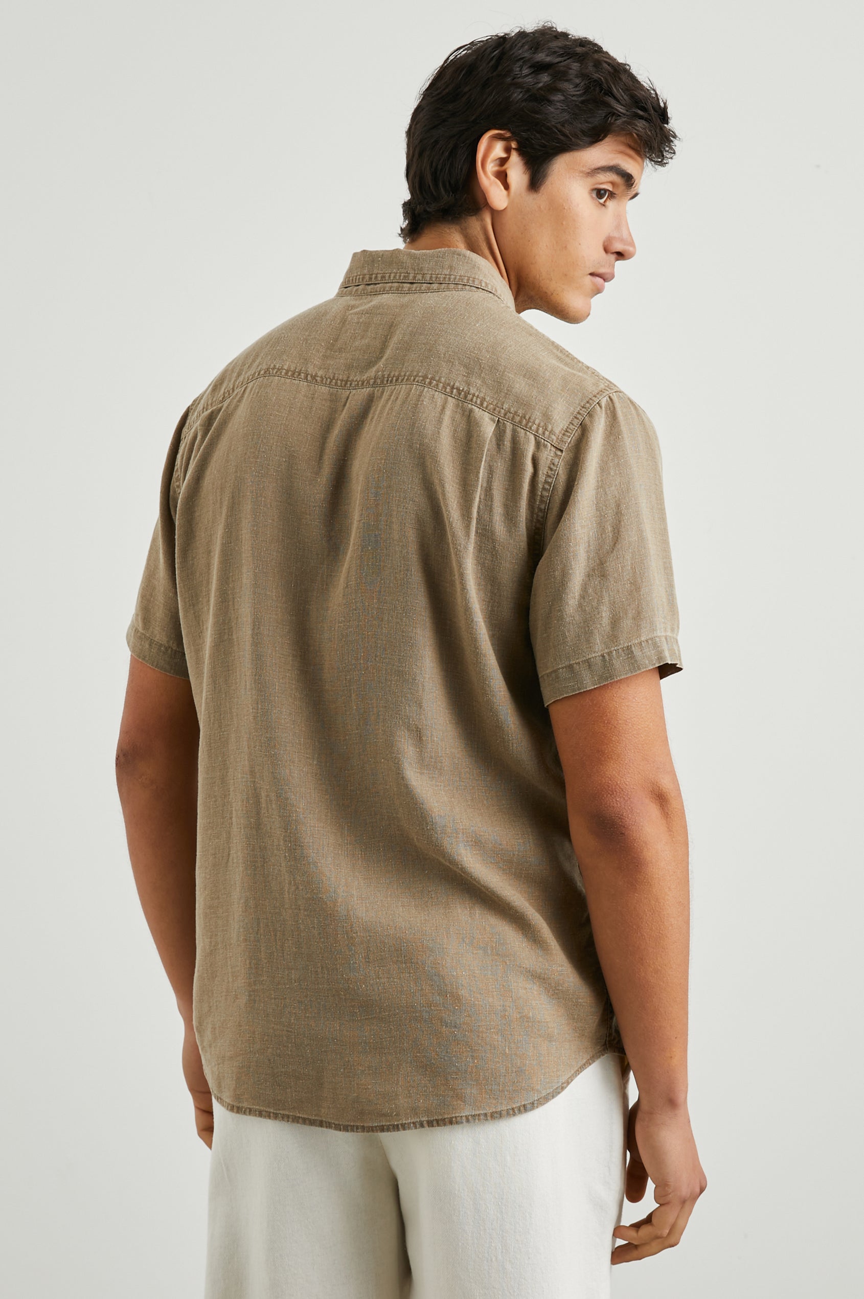Paros Short-Sleeve Button Up with a Chest Patch Pocket in Ashwagandha Colorway, a Brown - Back View Featured on Model