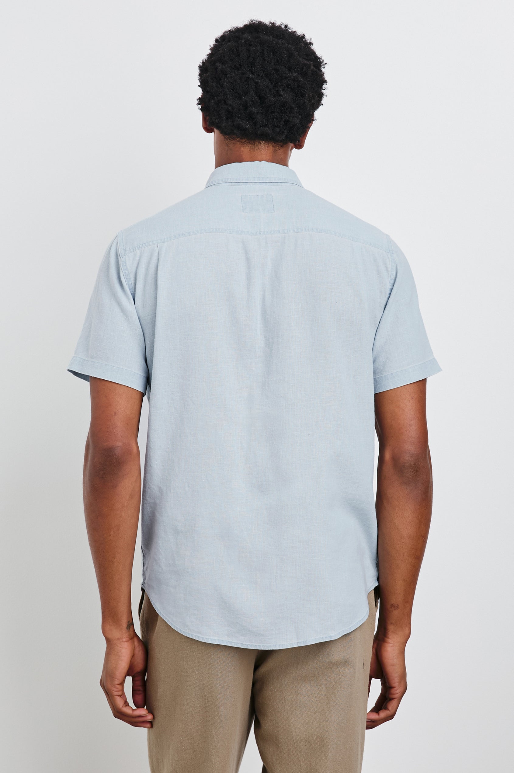 Paros button up short sleeve with front chest pocket in Blue Lagoon - back view on model
