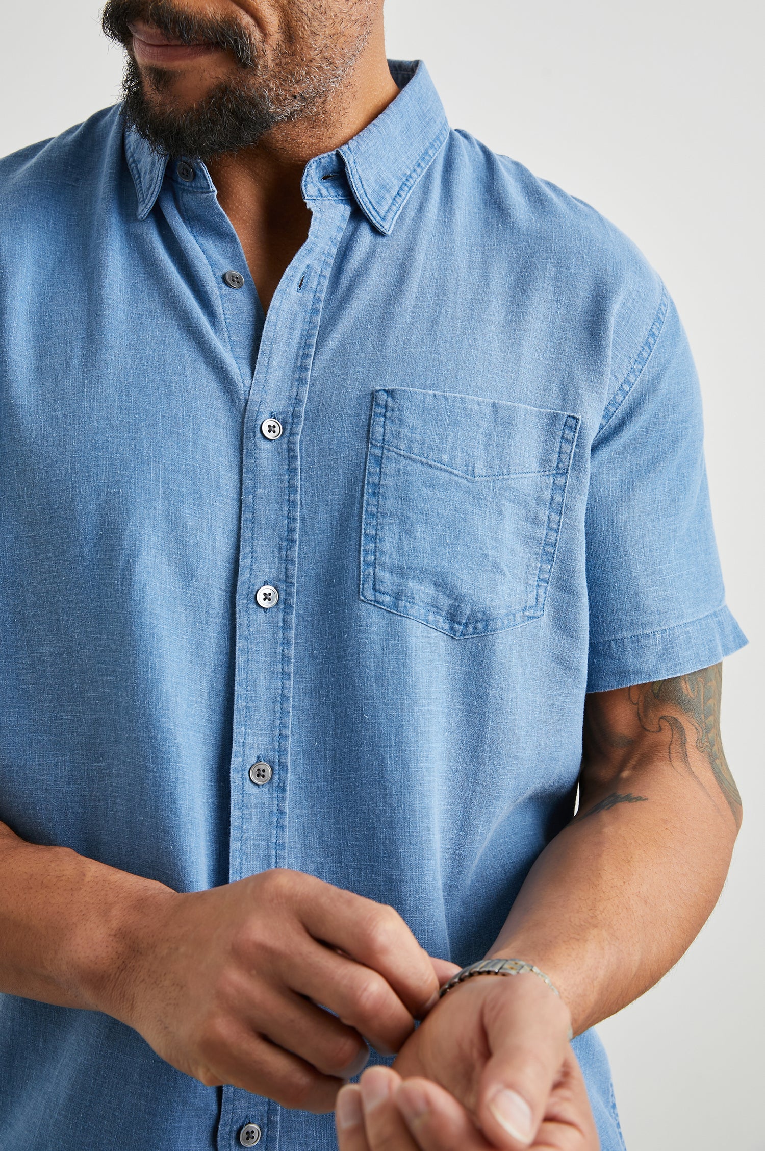 Paros Short-Sleeve Button Up with a Chest Patch Pocket in Celsius Colorway, a Blue - Front View Featured on Model