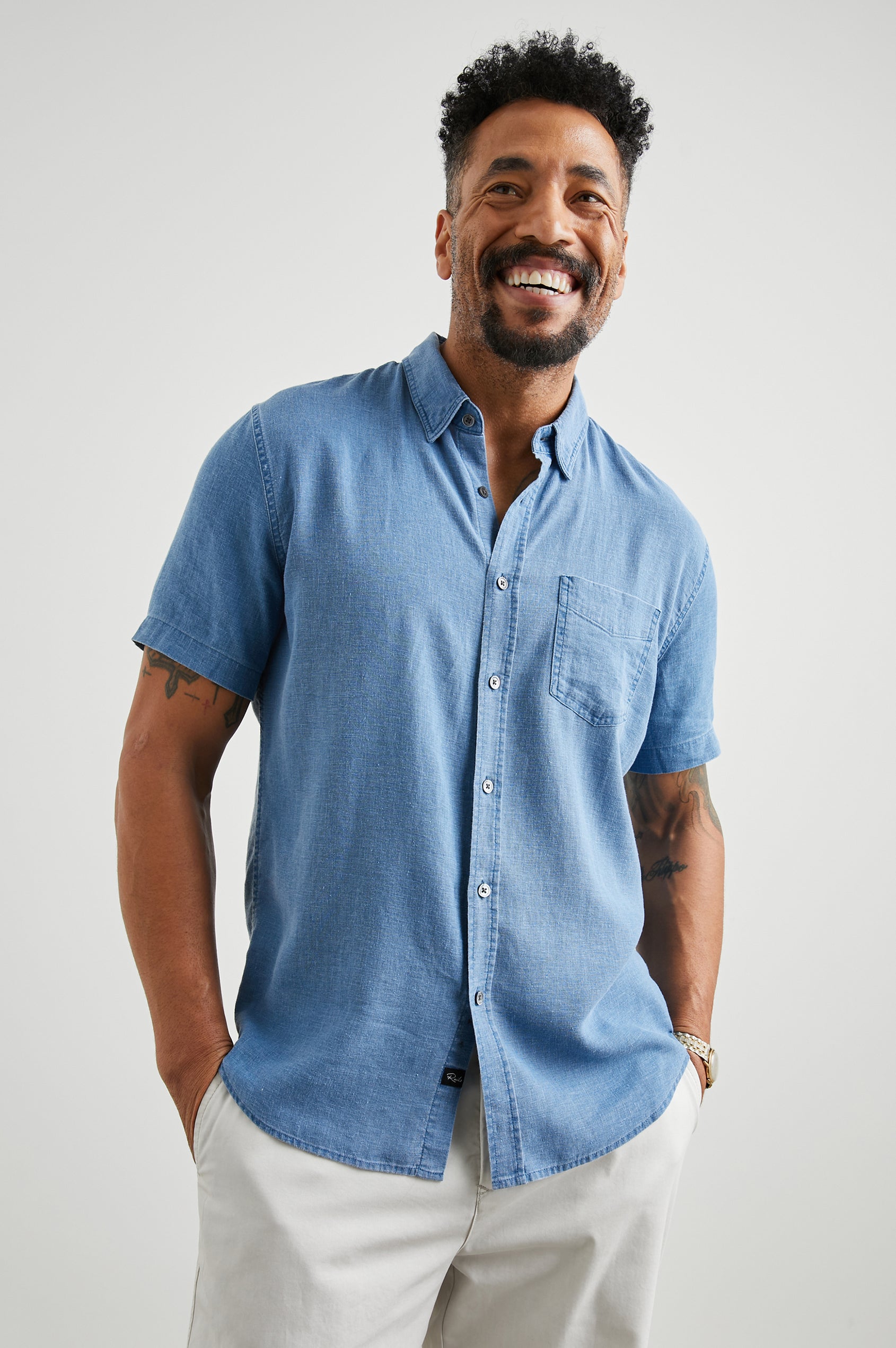 Paros Short-Sleeve Button Up with a Chest Patch Pocket in Celsius Colorway, a Blue - Front View Featured on Model