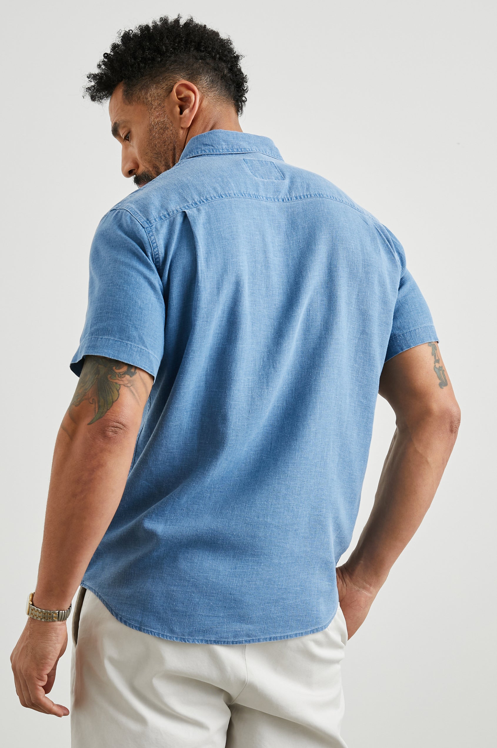 Paros Short-Sleeve Button Up with a Chest Patch Pocket in Celsius Colorway, a Blue - Back View Featured on Model