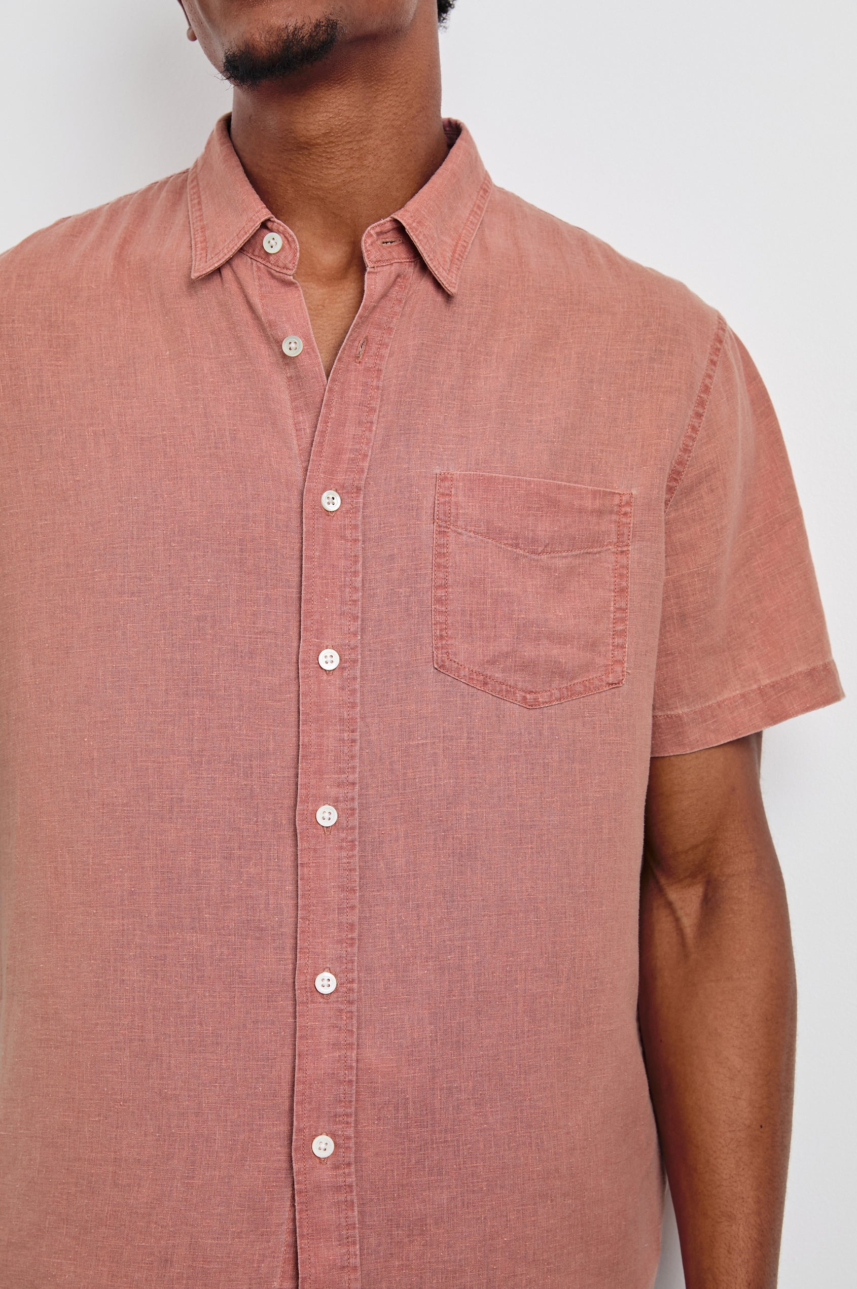 Paros button up short sleeve with front chest pocket and collar in Desert Rose -  close up of details on model
