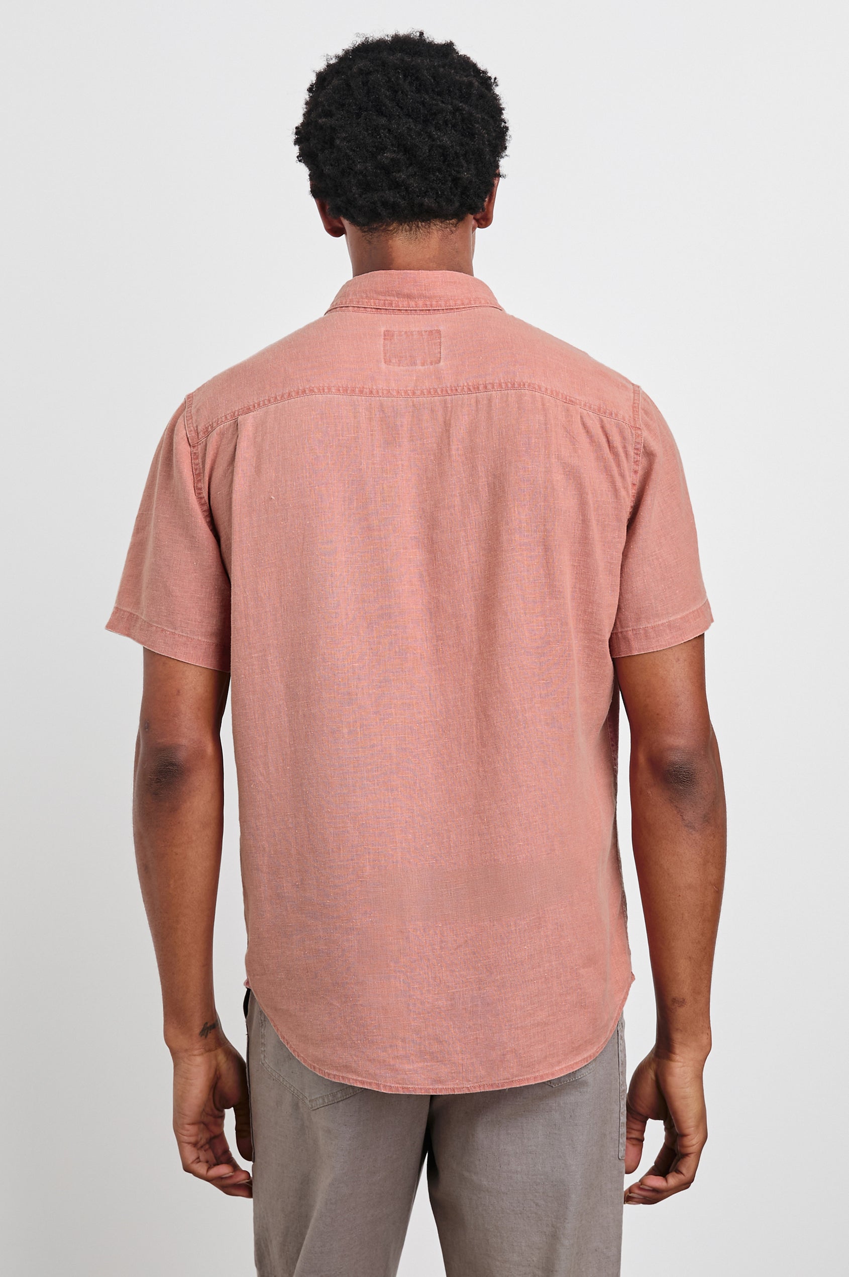 Paros button up short sleeve with front chest pocket and collar in Desert Rose -  back view on model