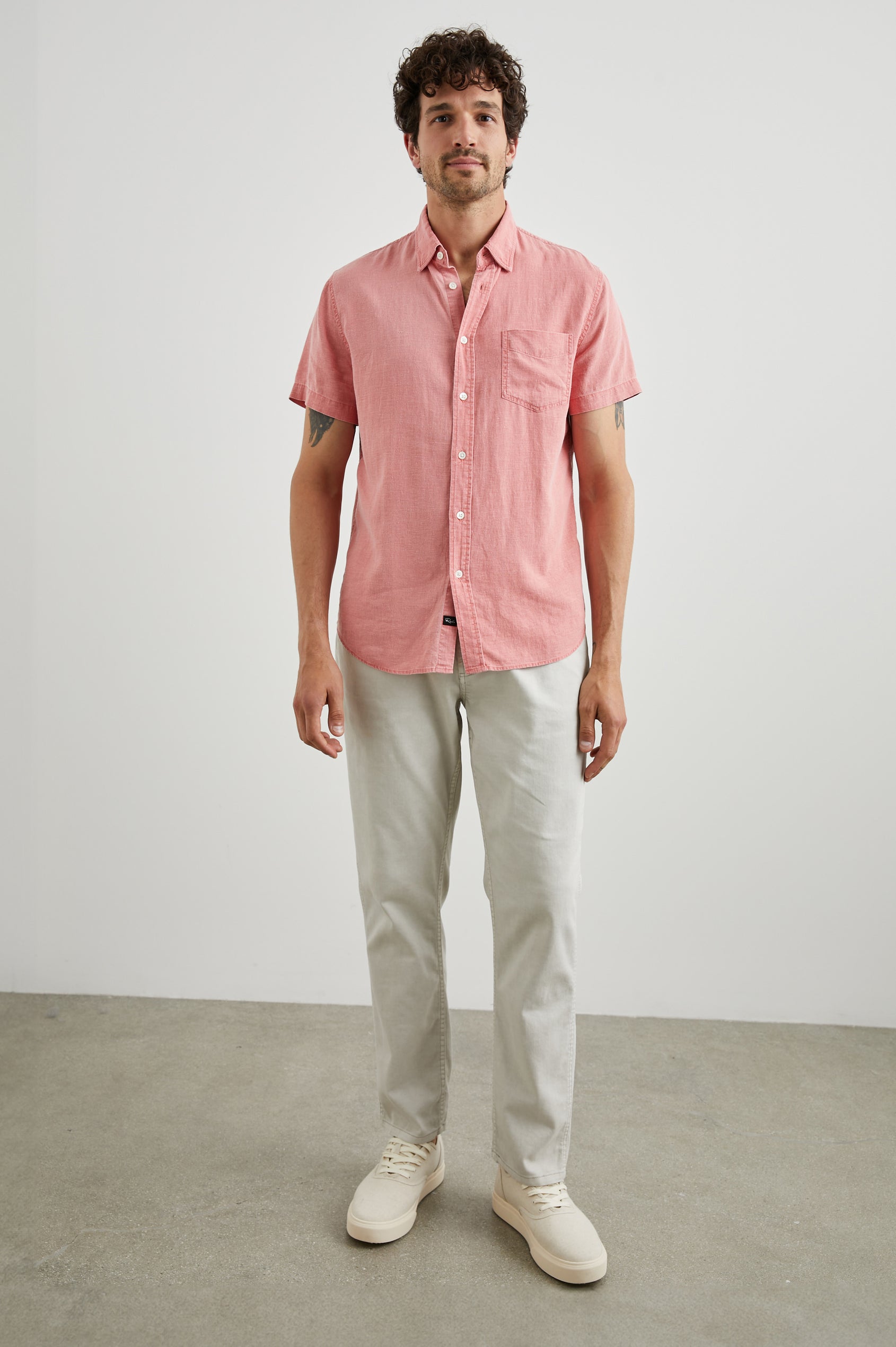 Paros Short-Sleeve Button Up with a Chest Patch Pocket in Equator Colorway, a Pink - Front Full Body View Featured on Model