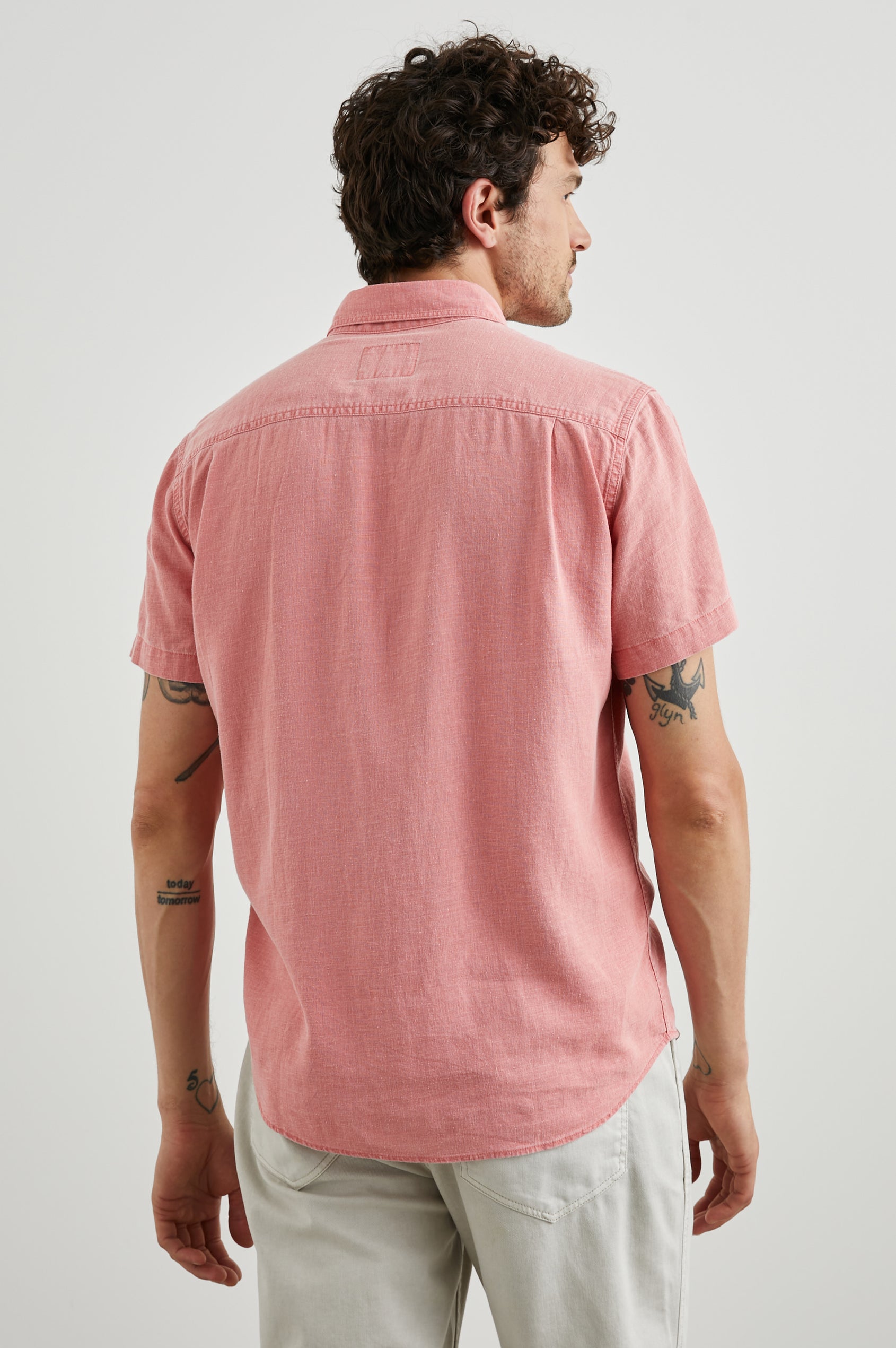 Paros Short-Sleeve Button Up with a Chest Patch Pocket in Equator Colorway, a Pink - Back View Featured on Model