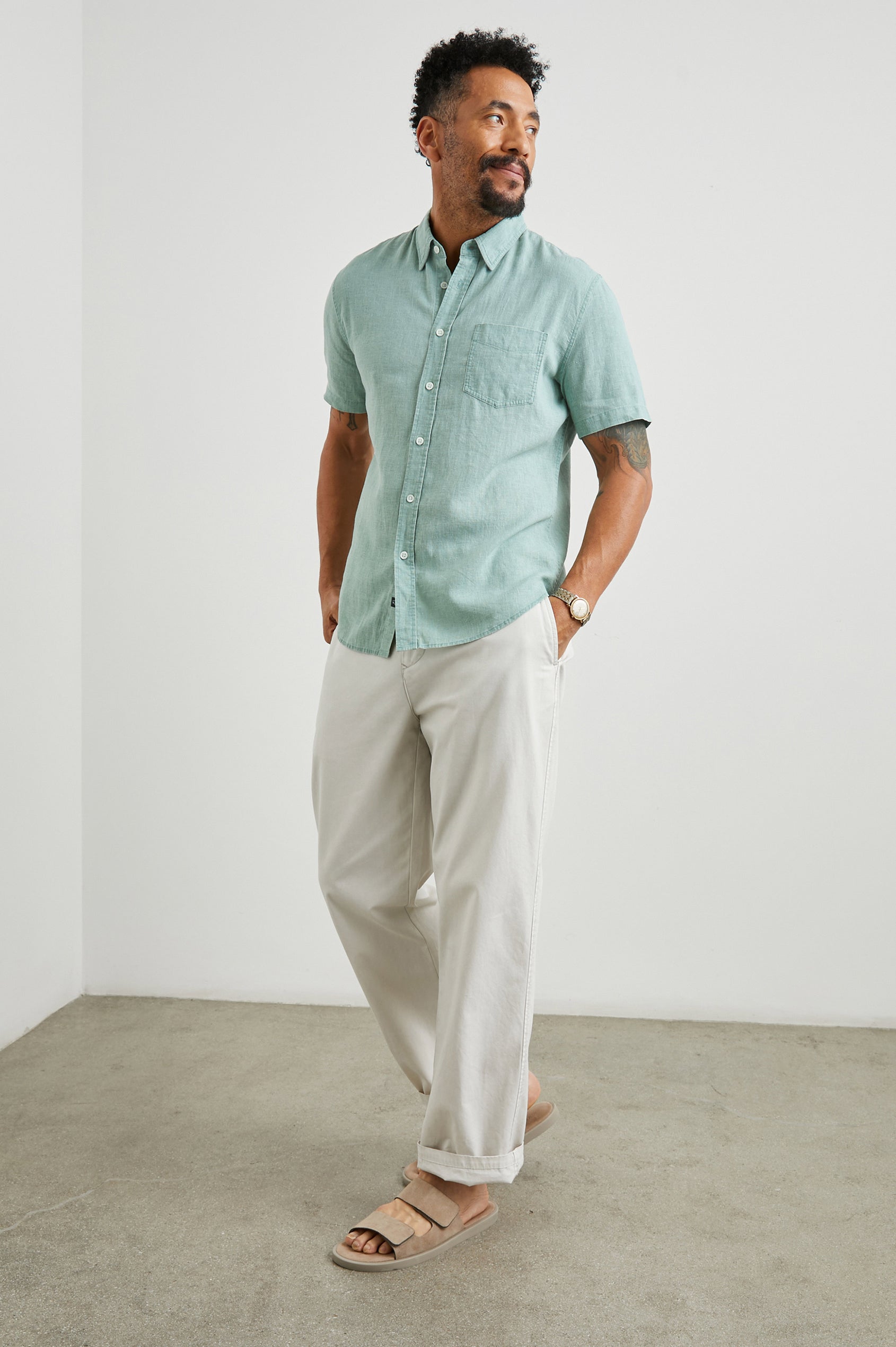 Paros Short-Sleeve Button Up with a Chest Patch Pocket in Jade Colorway - Front Full Body View Featured on Model