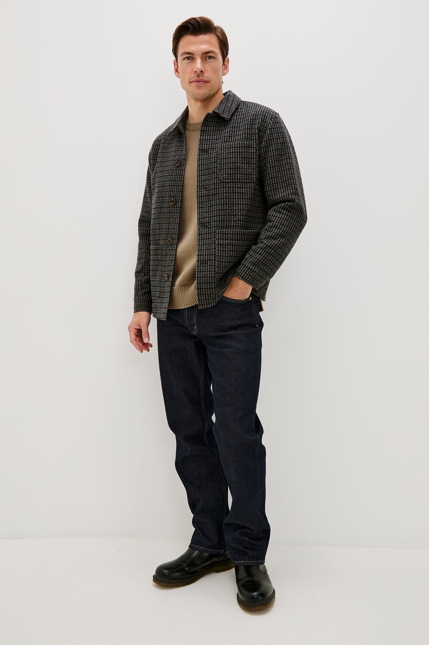 The Pascal is a collared button front jacket with front patch pockets and a chest pocket in Grey Check Plaid colorway. Front full body view featured on model.