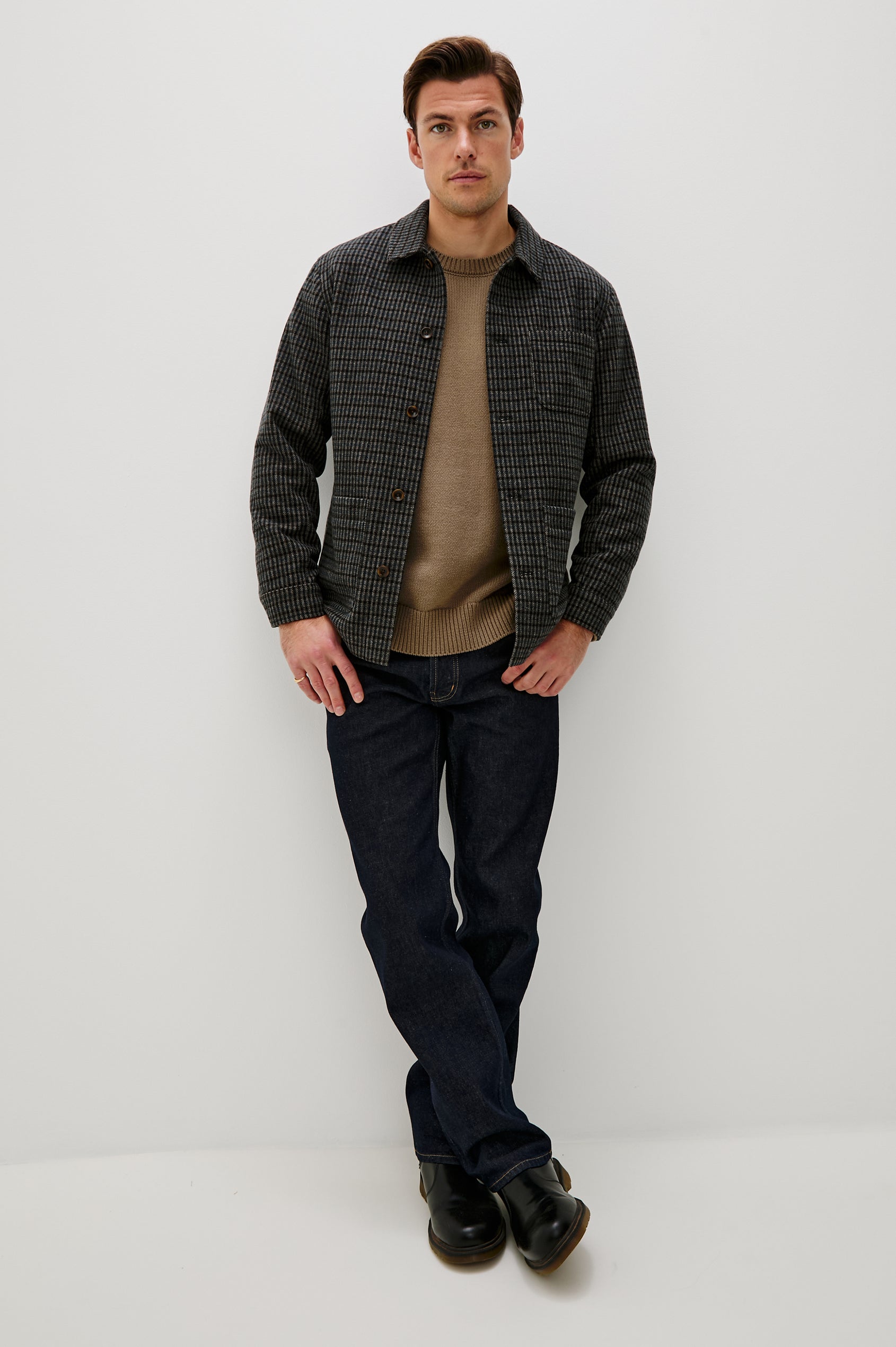 The Pascal is a collared button front jacket with front patch pockets and a chest pocket in Grey Check Plaid colorway. Front full body view featured on model.