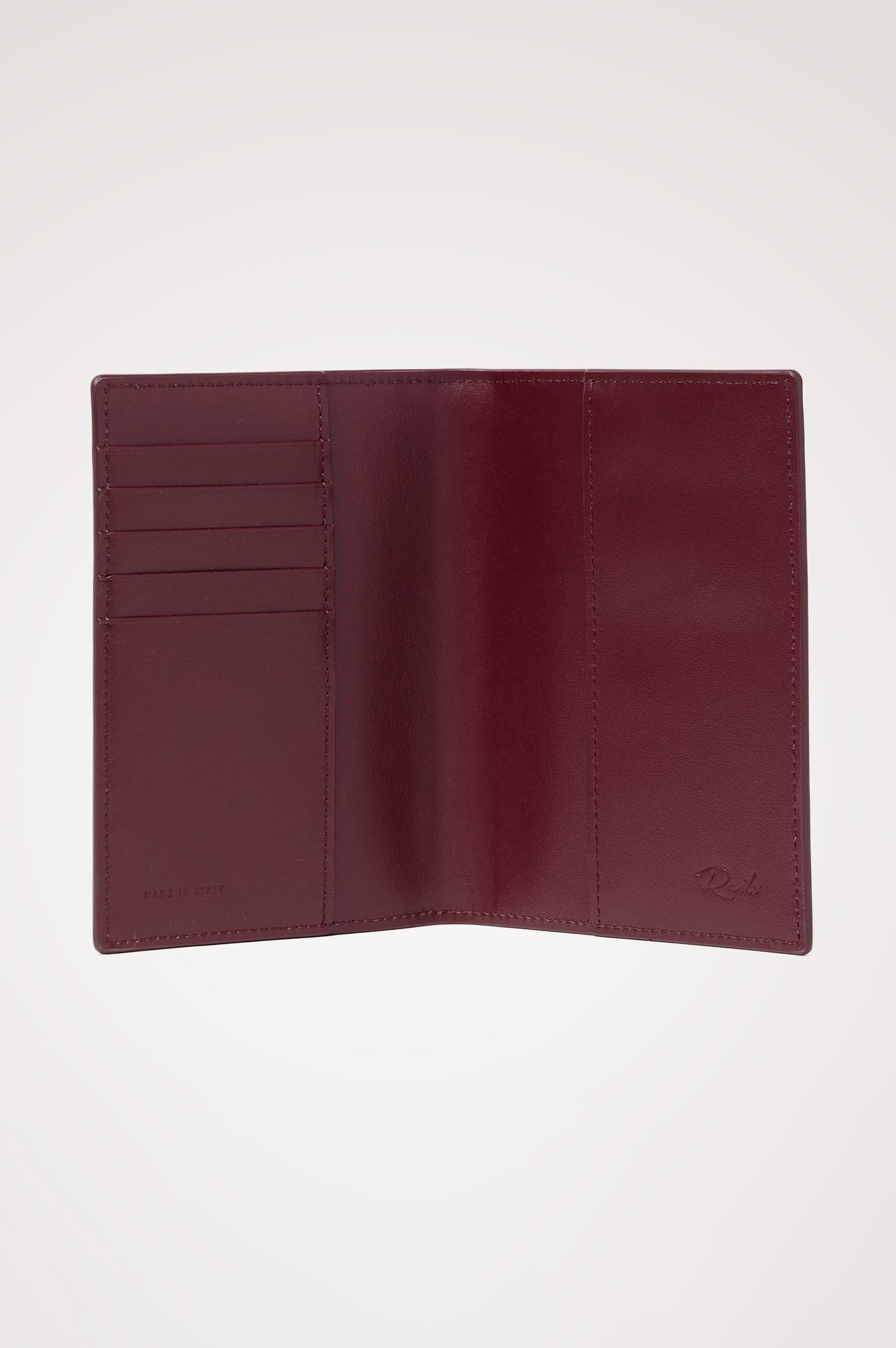Passport Holder in Croc-Embossed Spanish Leather With Five Card Slots, Two Side Pockets, and Embossed Rails Logo in Burgundy Croc Embossed Colorway - Interior view.