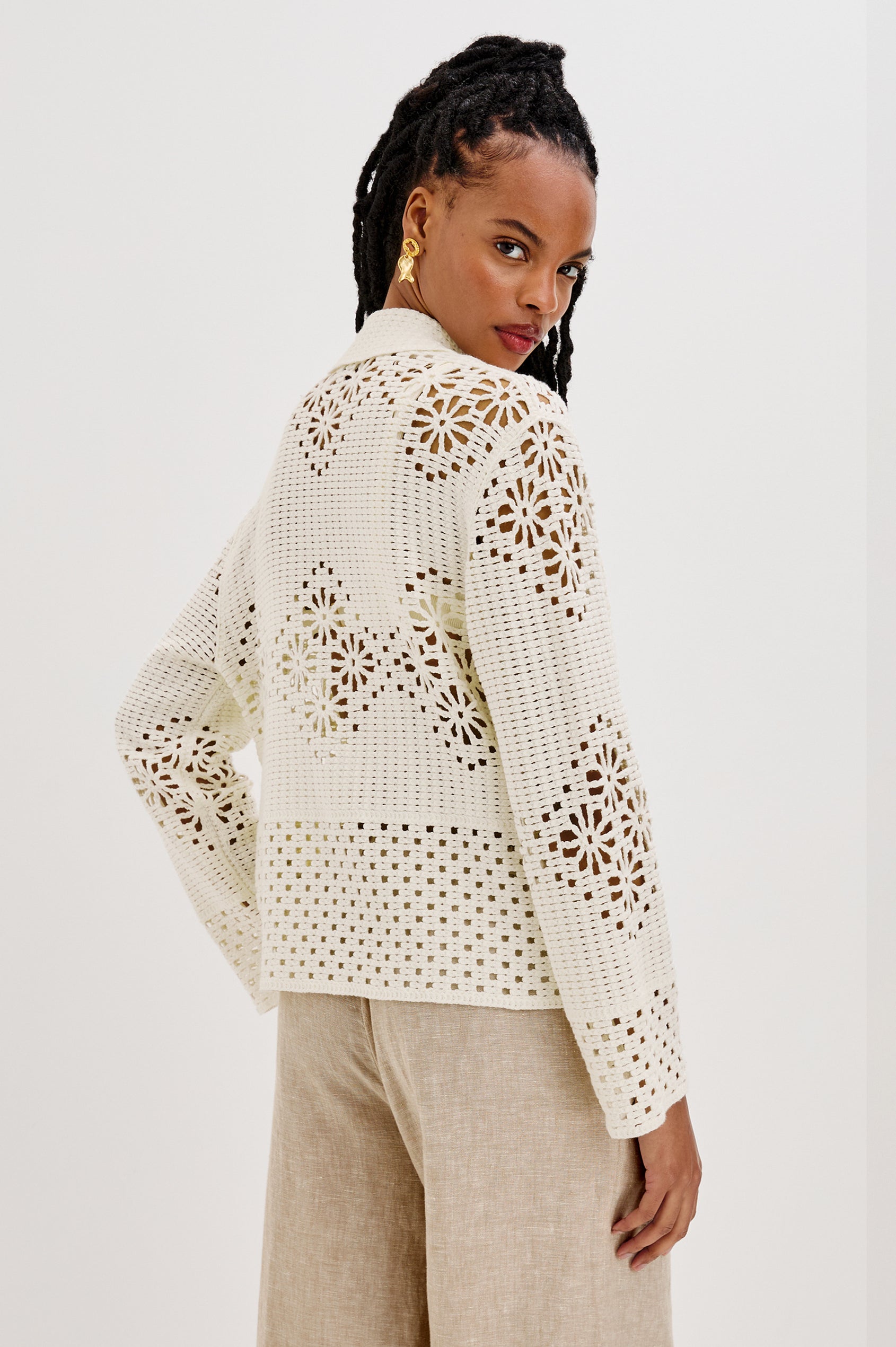 Patmos Collared Button Front Sweater Cardigan with Long Sleeves and Four Front Patch Pockets in Ivory Colorway. Back View Shown on Model.