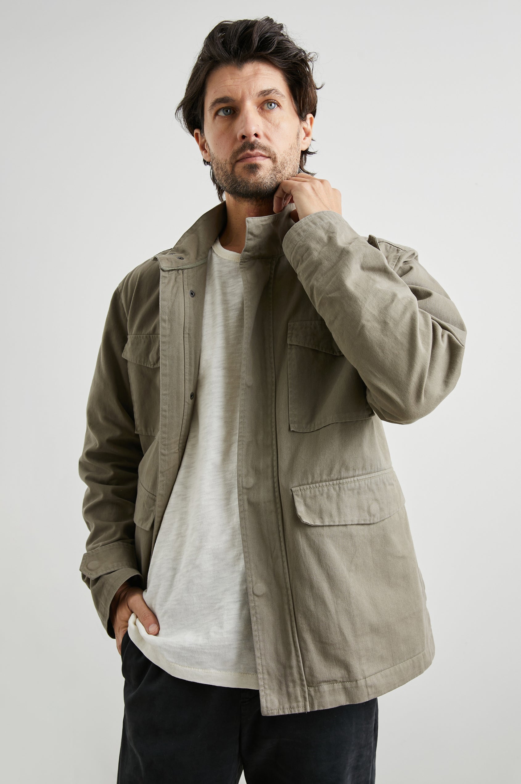 Paulsen Jacket with a Snap and Zip Closure, Two Front Snap Flap Pockets, Two Chest Snap Flap Pockets and a Snap Turnback in Sage Colorway - Front View Featured on Model 