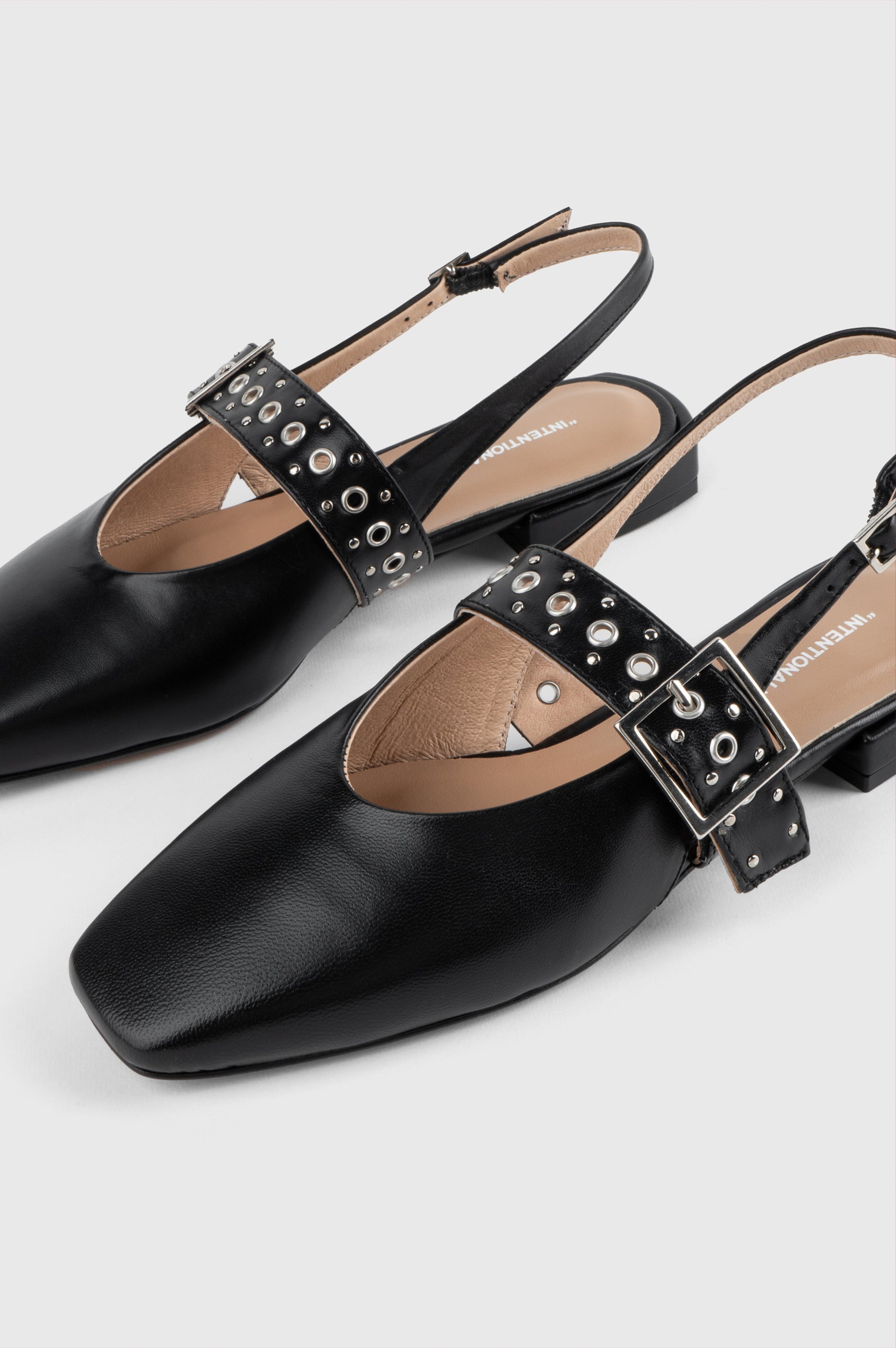 Intentionally Blank Pearl Ballet Flat with an Adjustable Slingback Strap, a Studded Upper Buckle Strap, a Small Heel and a Square Toe in Black Colorway - Overhead View 
