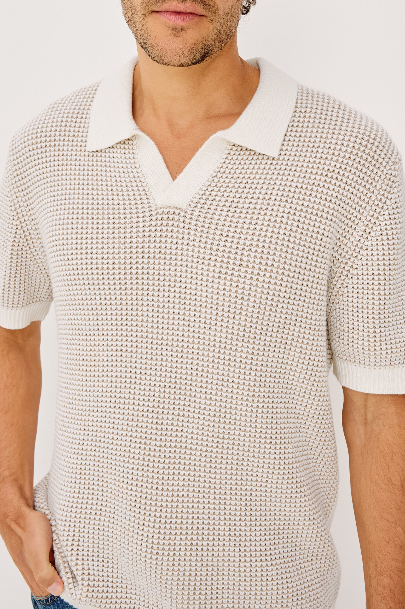 Pearson Polo Shirt in Textured Knit With Loose Fit, Short Sleeves, and Open-Placket Collar in White Sands Colorway - Upper Body Close Up View Featured on Model