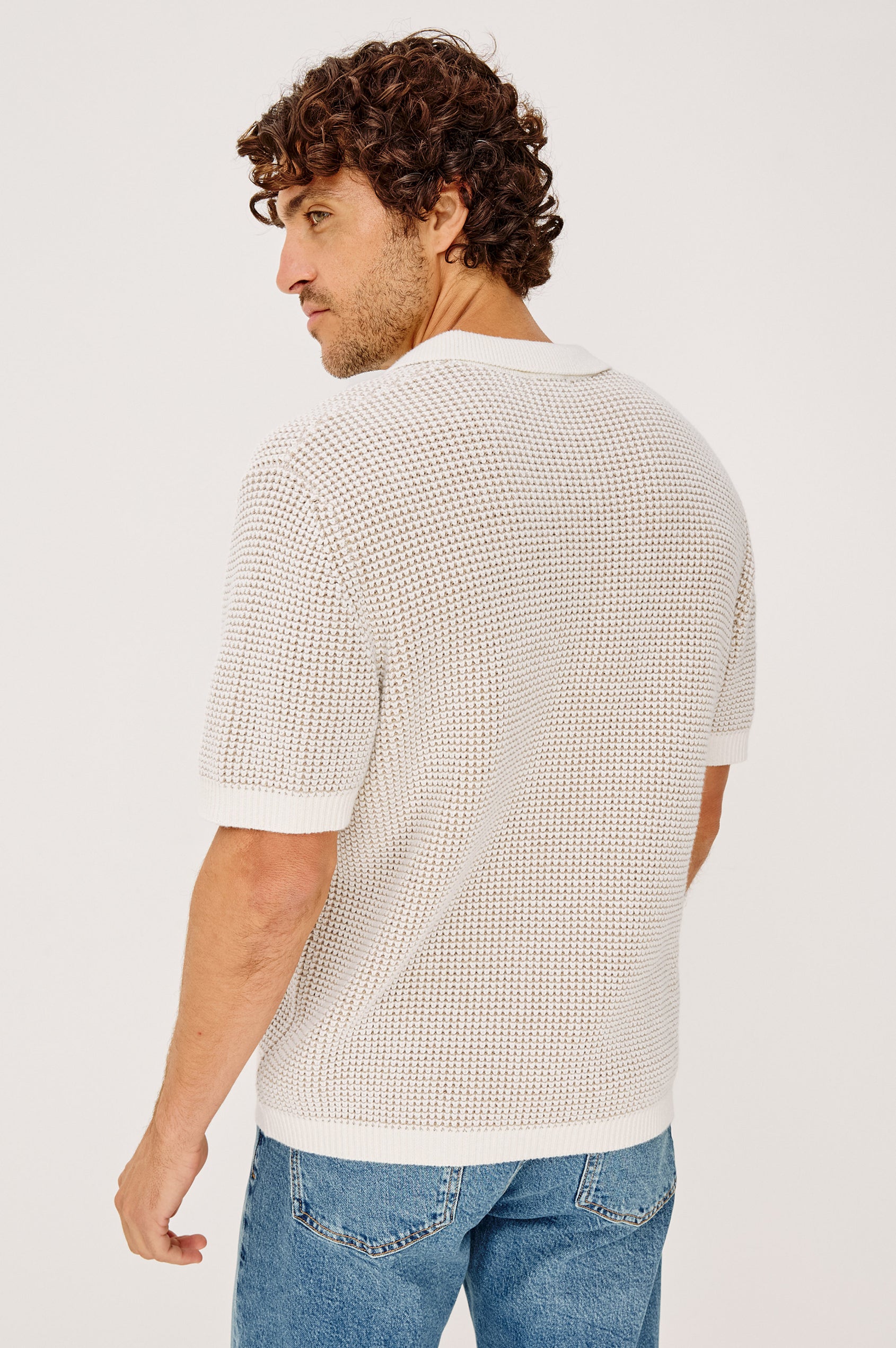 Pearson Polo Shirt in Textured Knit With Loose Fit, Short Sleeves, and Open-Placket Collar in White Sands Colorway - Upper Body Back View Featured on Model