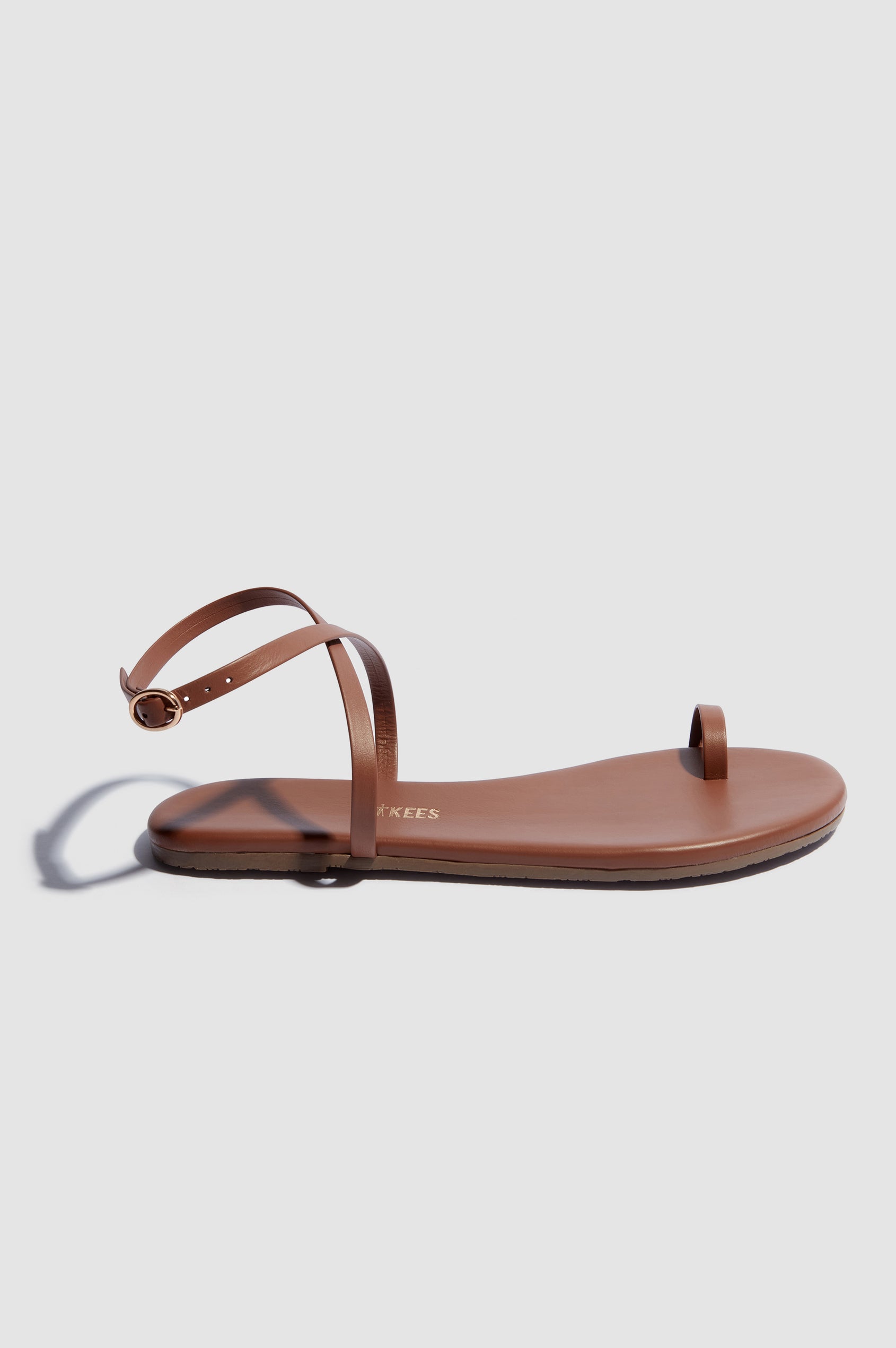 Phoebe leather sandal with toe ring and crossed ankle strap with buckle in Heatwave - side view of single shoe