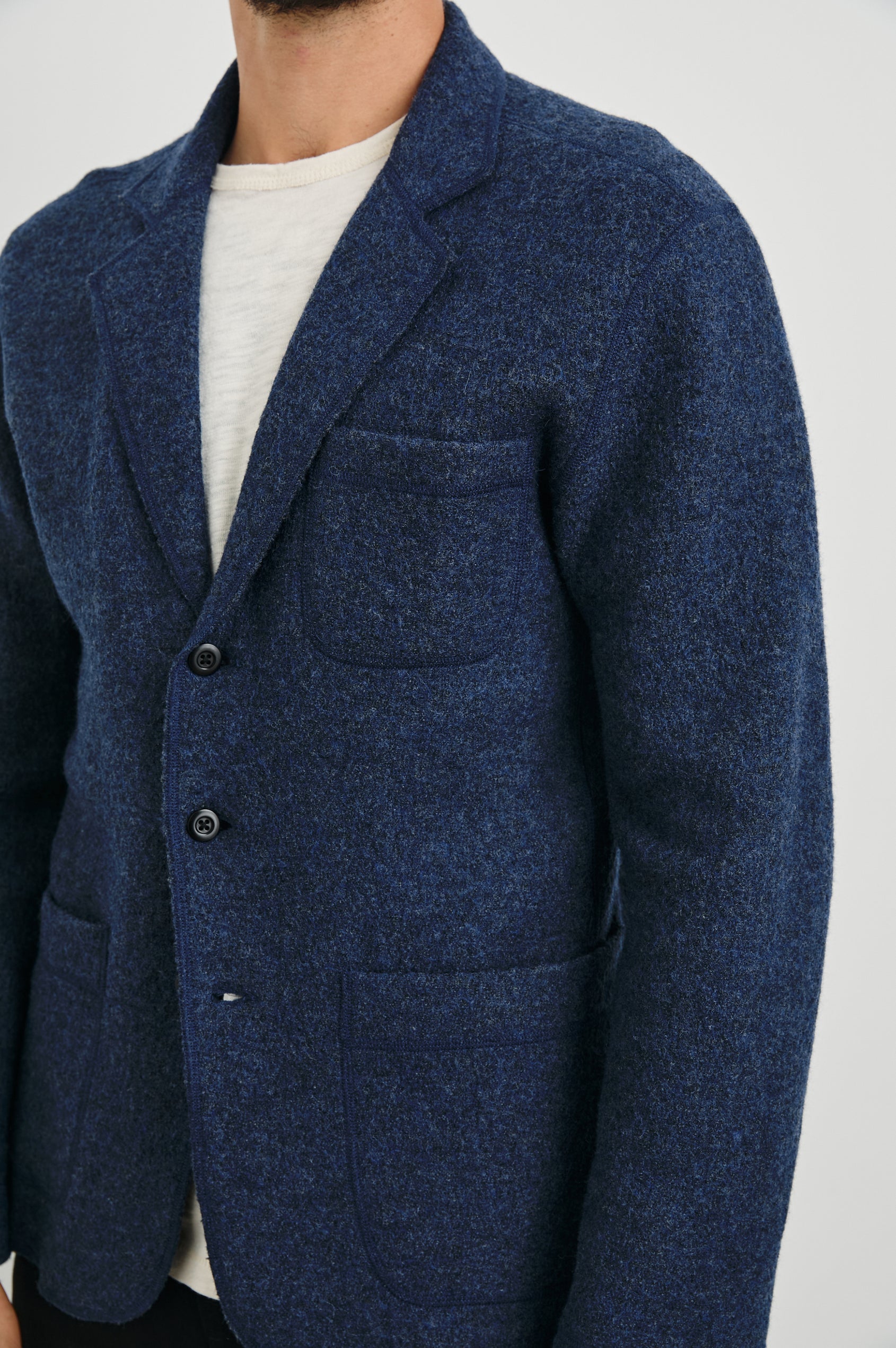 Pierre Blazer with Three Button Closure, Two Front Patch Pockets, a Chest Patch Pocket in Blue Melange Colorway - Front View Featured on Model