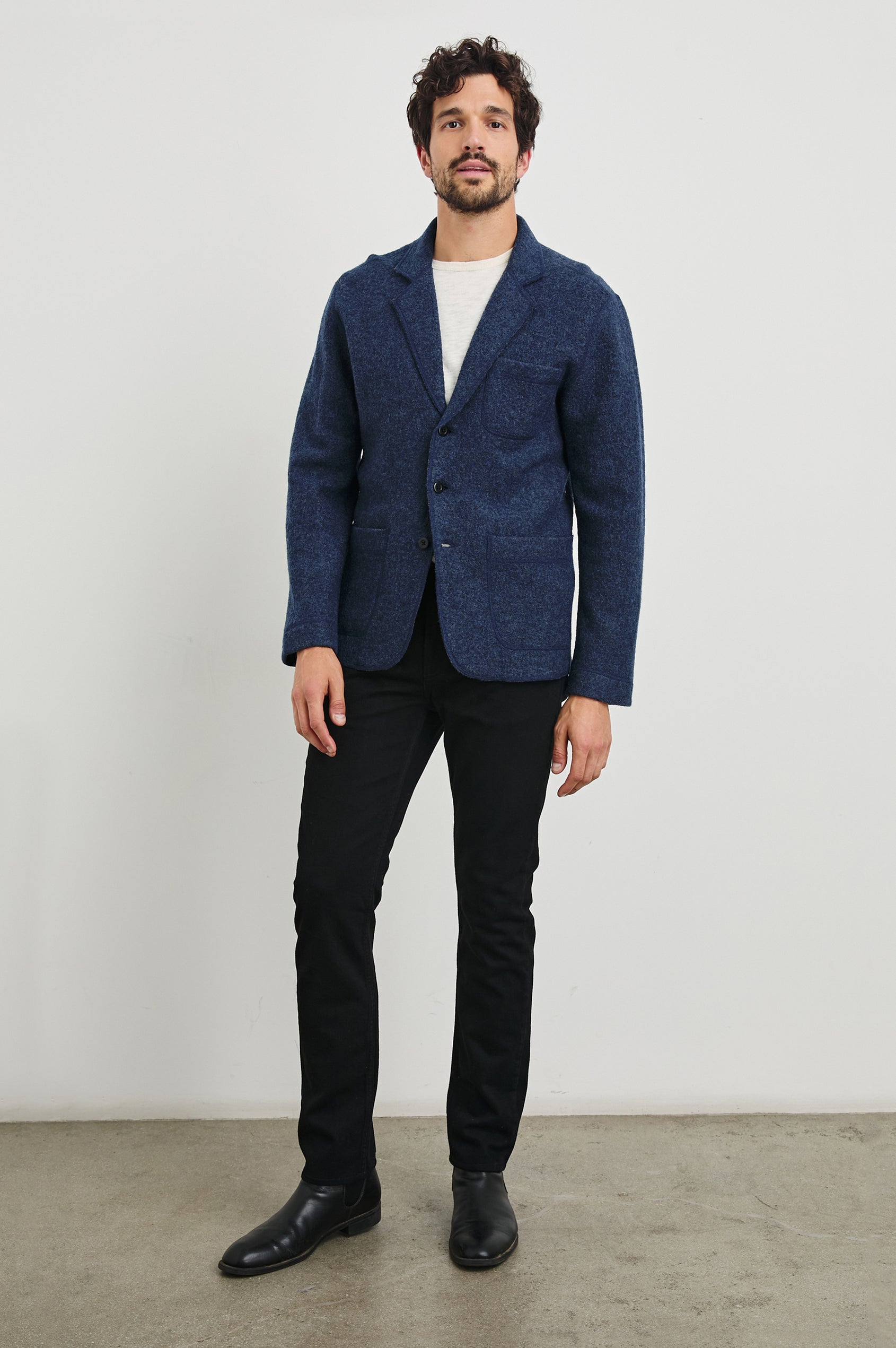Pierre Blazer with Three Button Closure, Two Front Patch Pockets, a Chest Patch Pocket in Blue Melange Colorway - Front Full Body View Featured on Model