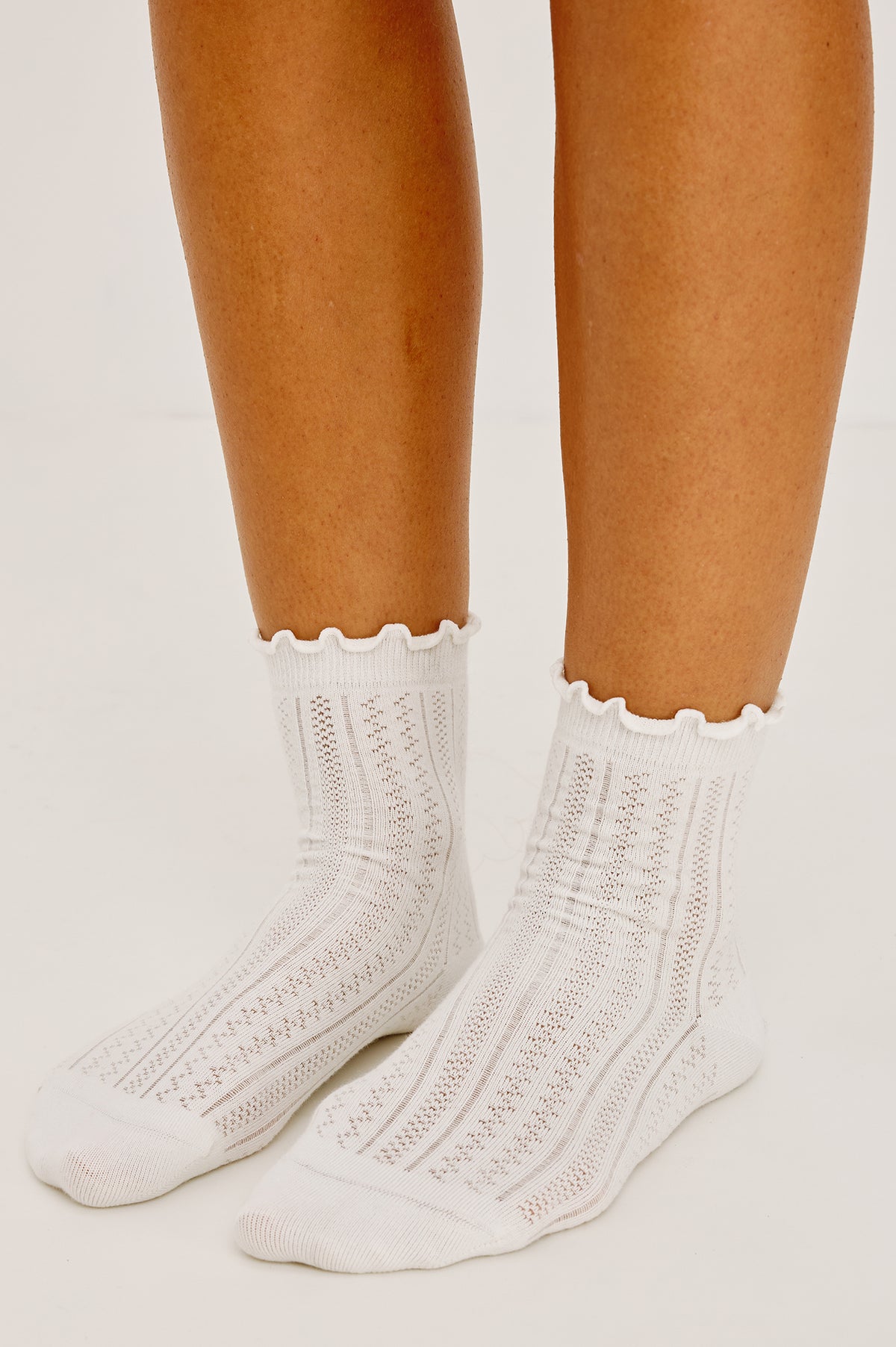 Pointelle Crew Socks in Soft Cotton Blend With Ruffle Trim in Ivory Colorway - Upper Body Front Detail View Featured on Model.