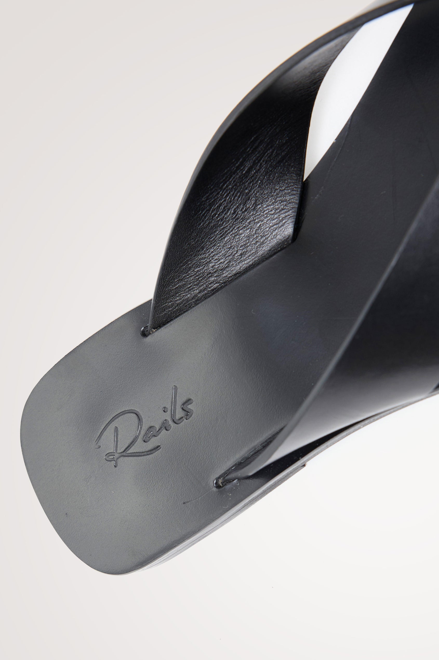 Porto Thong Sandal in Leather With Square Toe and Cushioned Footbed With Branded Embossed Detail in Black Colorway - Top View Featured on Model