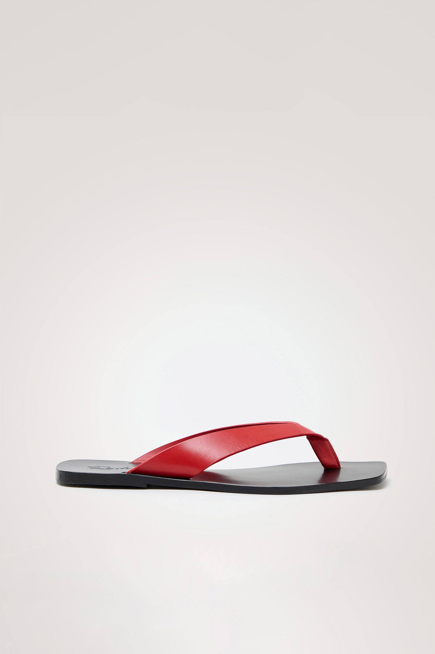 Porto Thong Sandal in Leather With Square Toe and Contrast Cushioned Footbed With Branded Embossed Detail in Tomato Colorway - Side View Featured