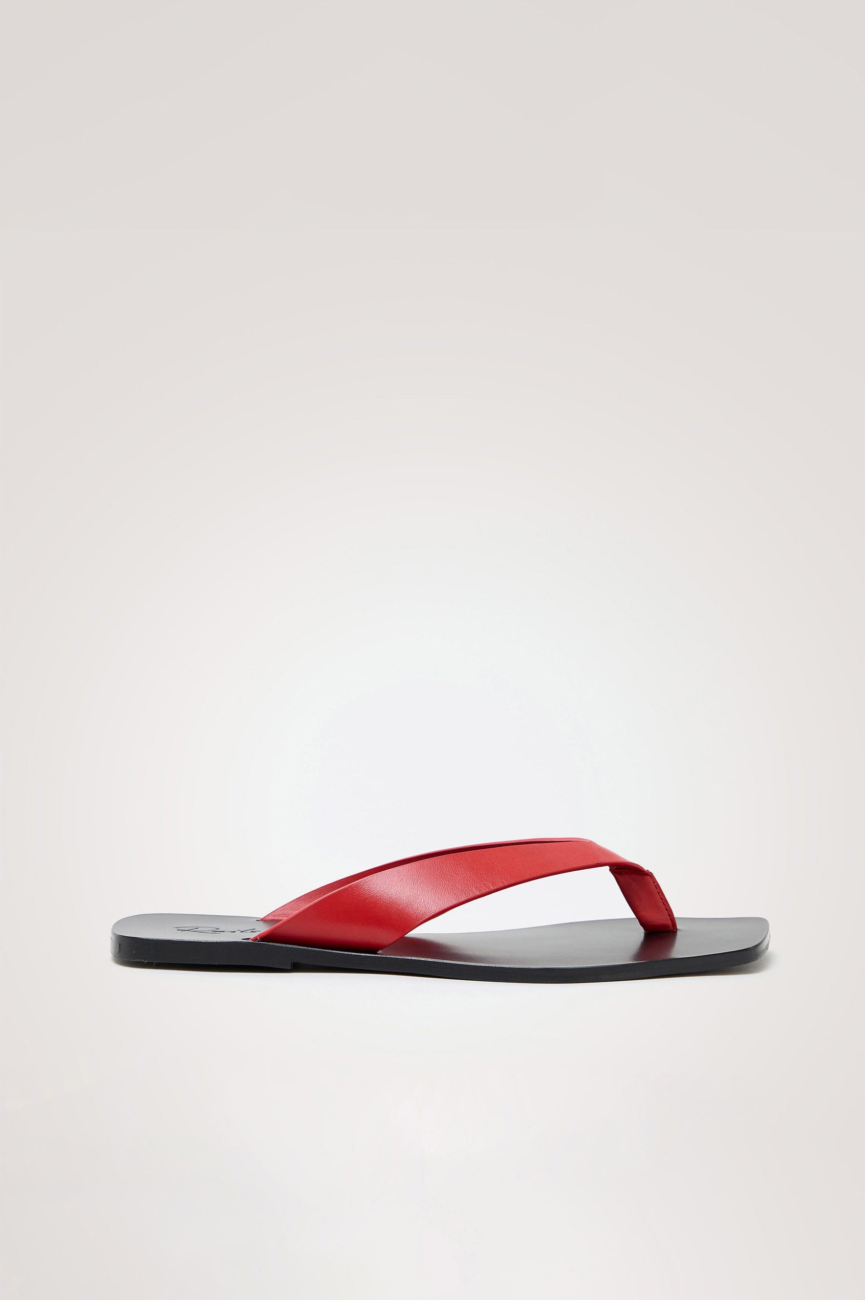 Porto Thong Sandal in Leather With Square Toe and Contrast Cushioned Footbed With Branded Embossed Detail in Tomato Colorway - Side View Featured