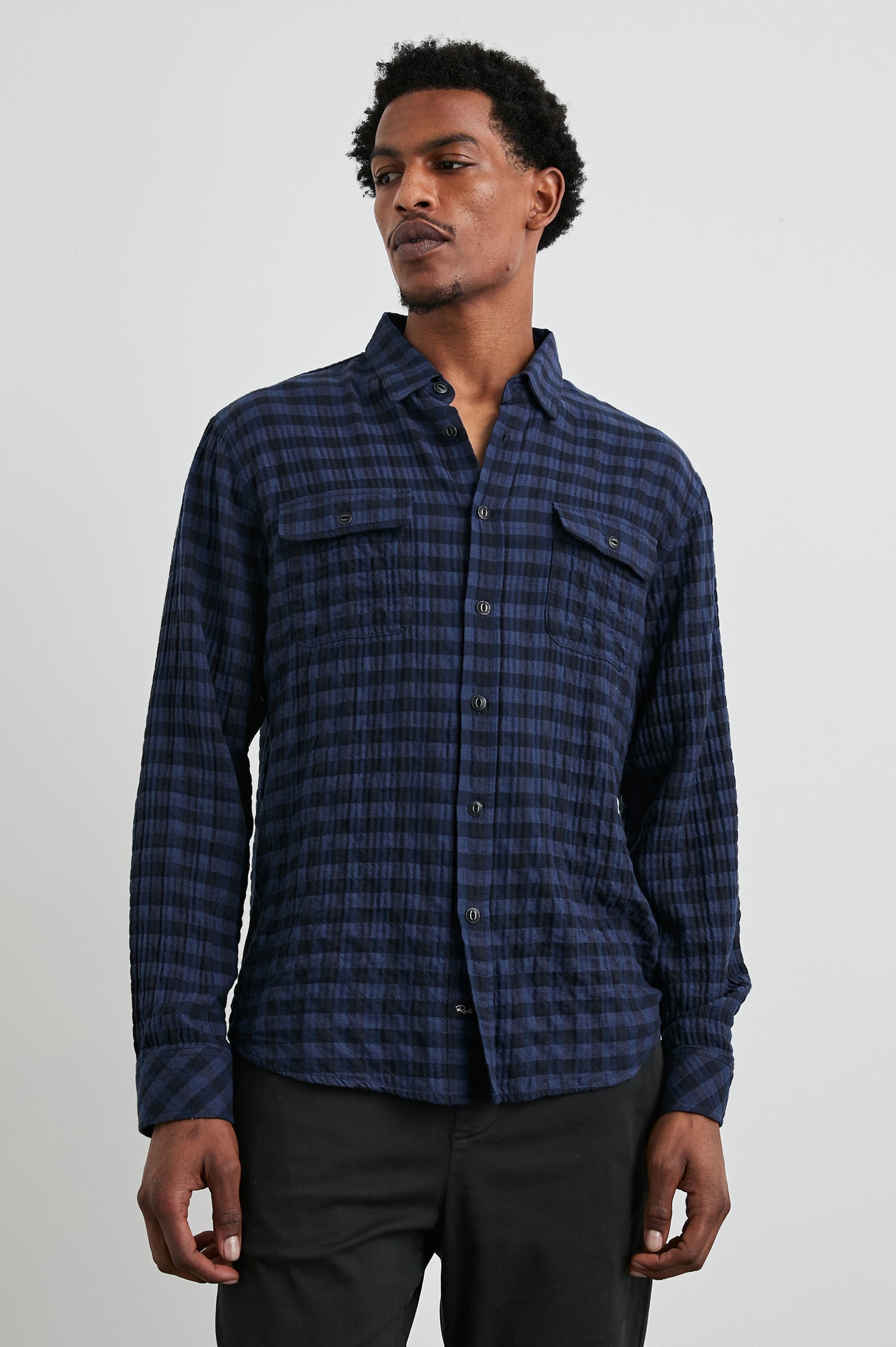 Powell Long-Sleeve Button Up with Textured Cotton and Two Chest Buttoned Flap Pockets in Blue Jay Royal Colorway, a Blue and Black plaid - Front View Featured on Model